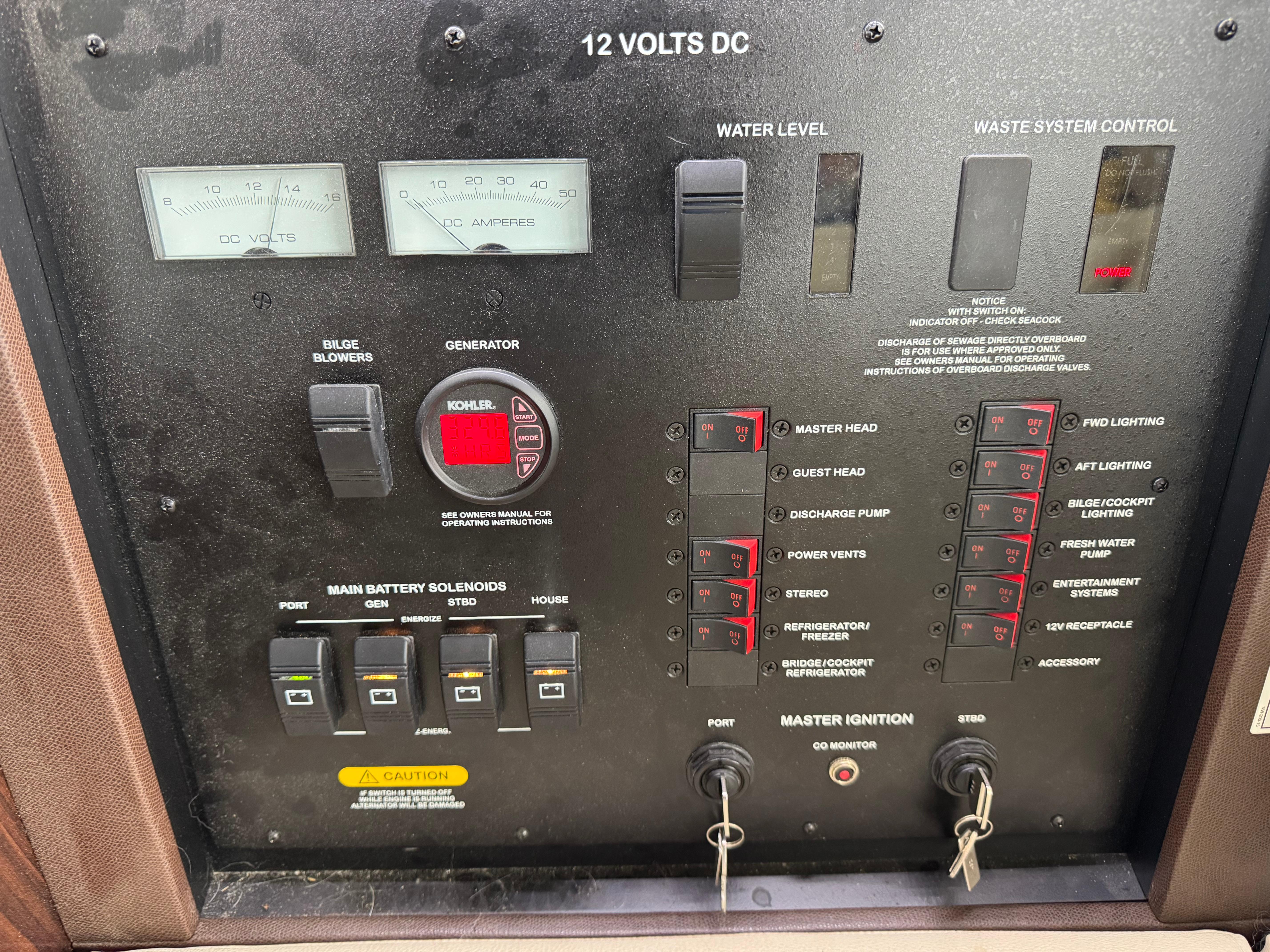 Control panel of a 2017 Sea Ray Sundancer 400 yacht, featuring various switches and gauges.