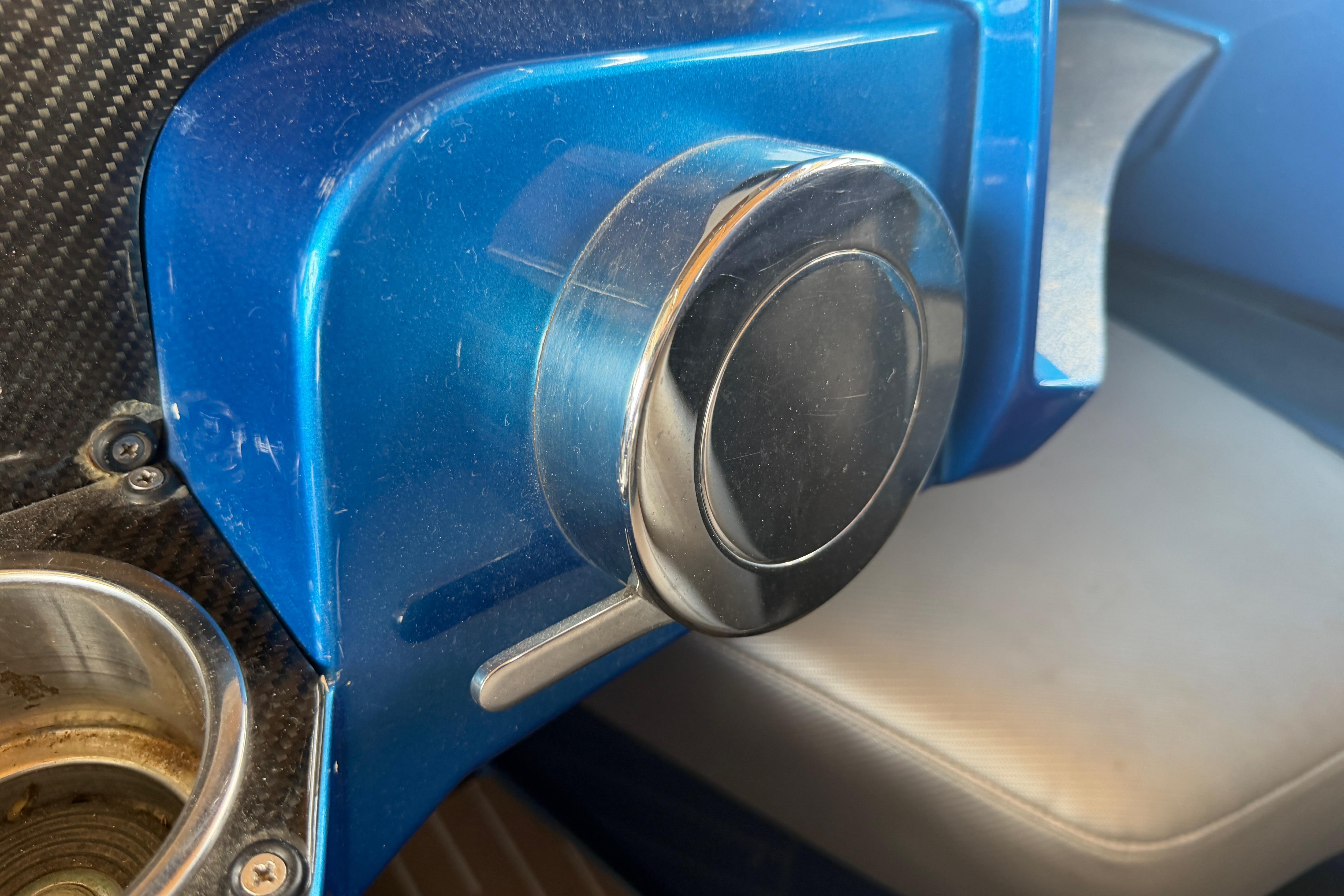 Close-up of a 2013 Nor-Tech 477 SPX Vee Bottom boat's blue dashboard detail.