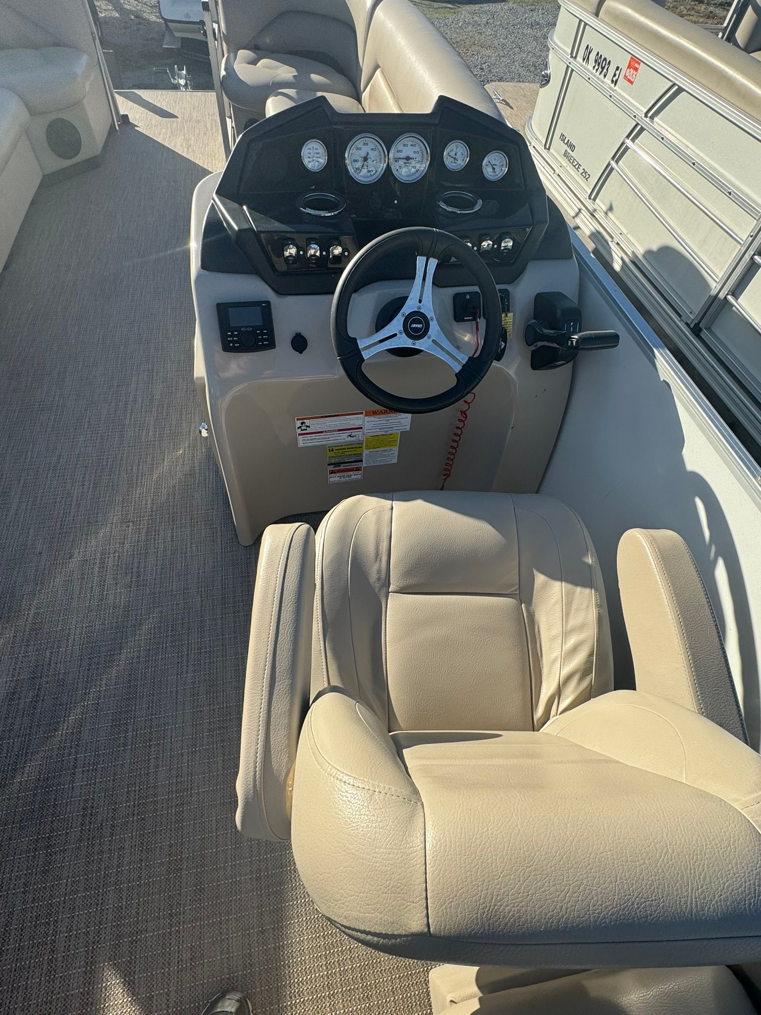 Interior of 2024 Landau 252 Island Breeze boat with helm console.