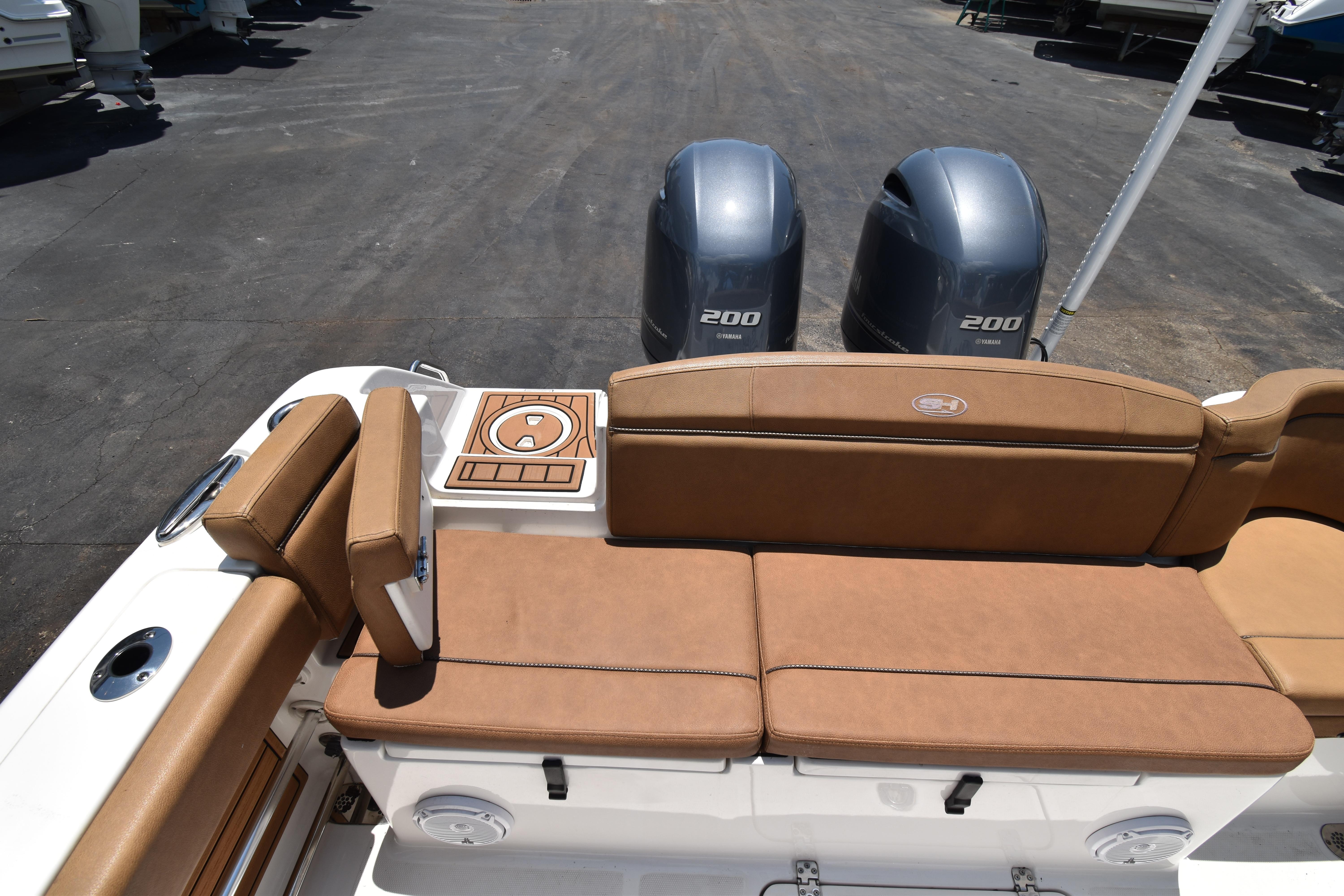 2020 Sea Hunt Ultra 275 SE boat with dual Yamaha 200 engines and tan seating.