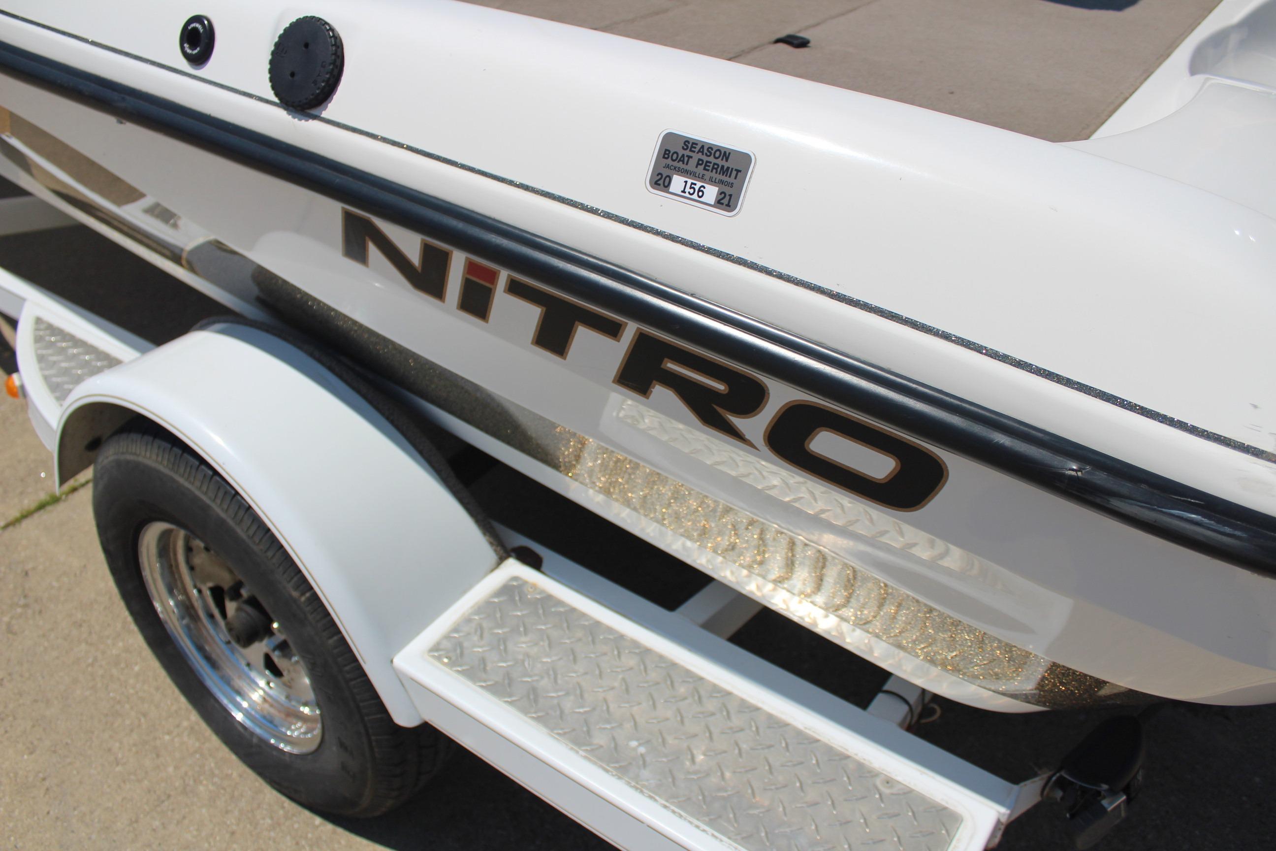 2003 Nitro NX 750 SC boat trailer with season permit sticker, white and black design.
