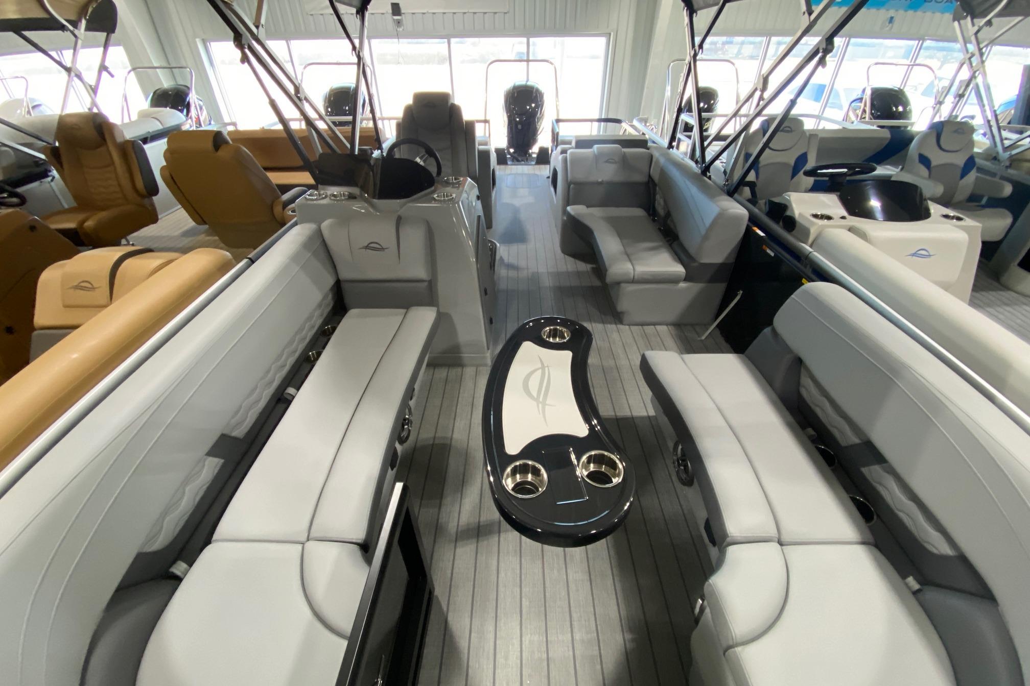 Luxurious interior of 2026 SunCatcher Fusion 324SS pontoon boat with plush seating and sleek design.
