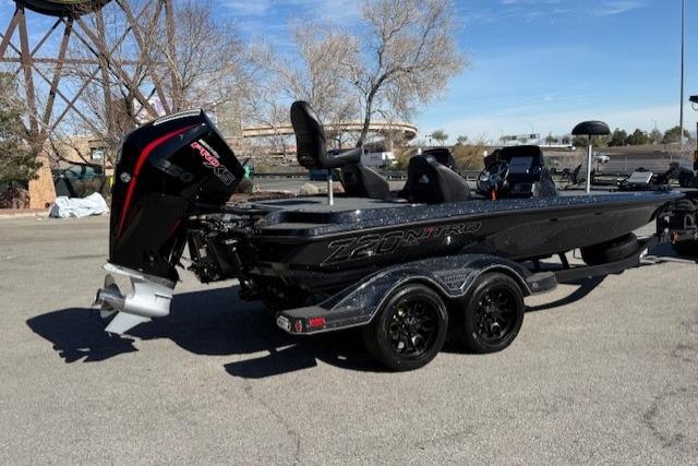 2026 Nitro Z20 XL Pro boat with powerful outboard motor, parked on pavement.