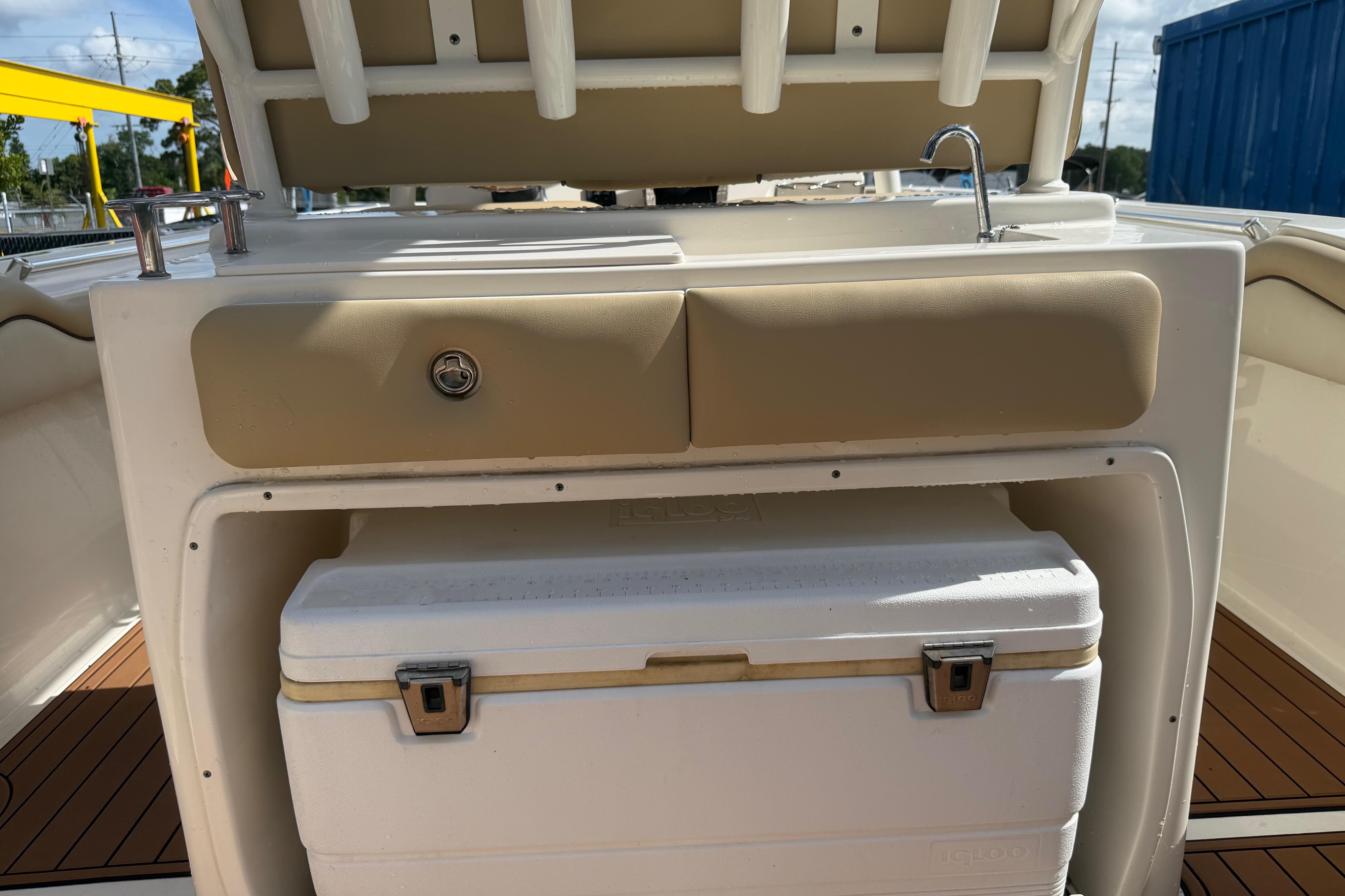 2019 Key West 263 FS boat interior with sink and storage compartment.