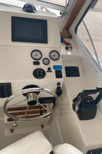 Helm of the 2015 Eastern 27 Islander with steering wheel and instruments.
