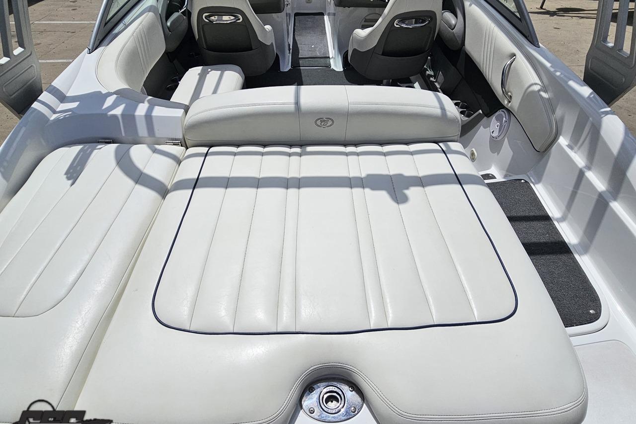 2010 Cobalt 232 WSS boat interior with white leather seating and modern design.
