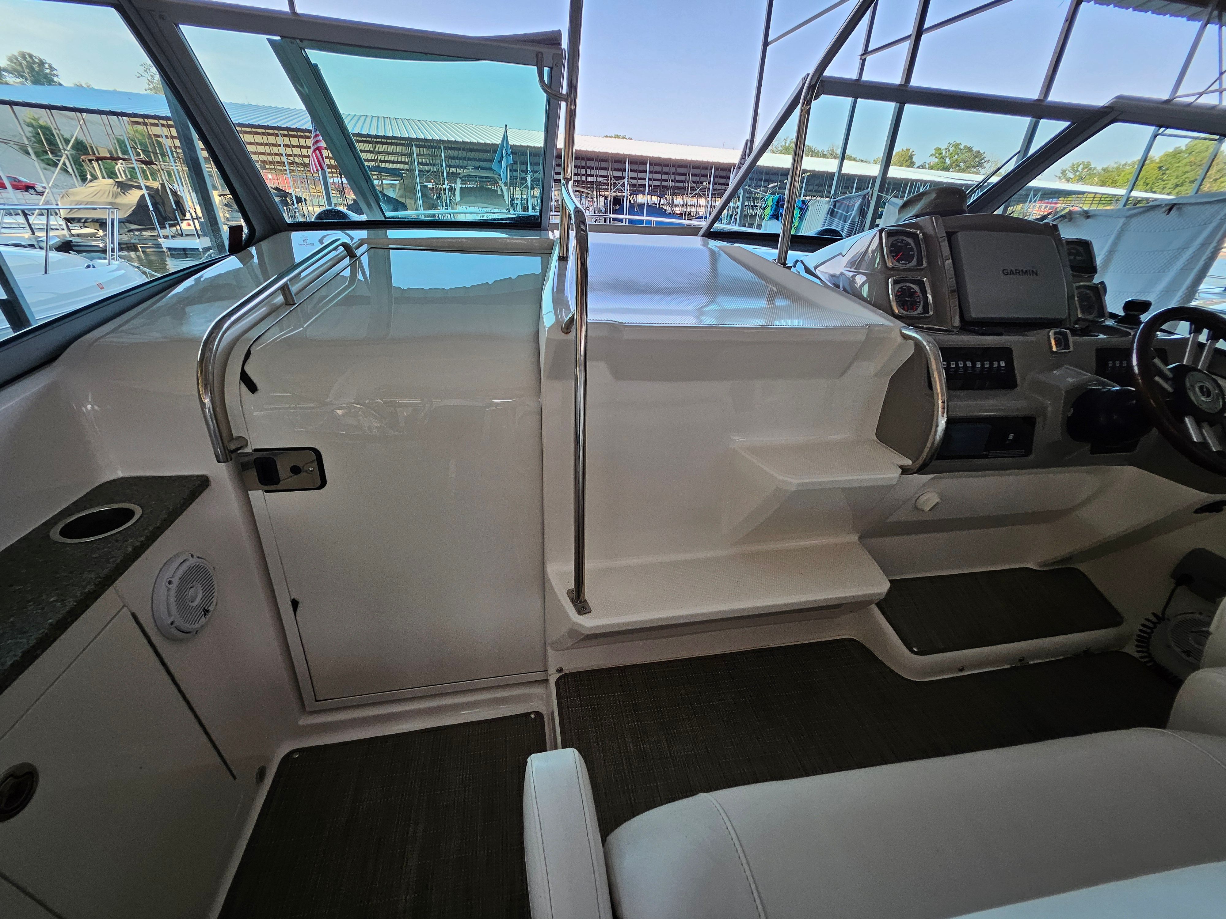 Interior of a 2014 Chaparral 330 Signature boat with helm console.