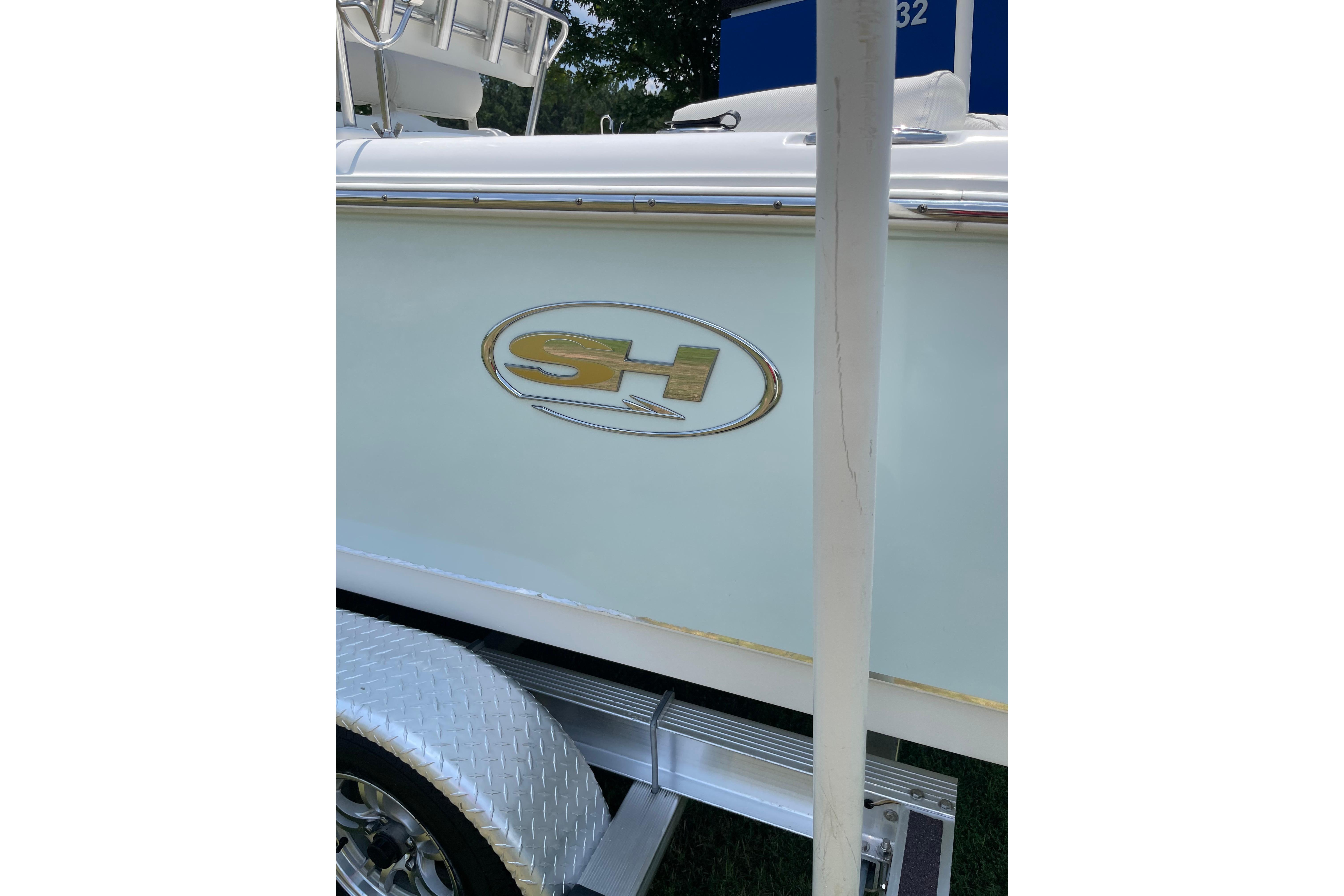 2018 Sea Hunt Ultra 234 boat side view with logo and trailer detail.