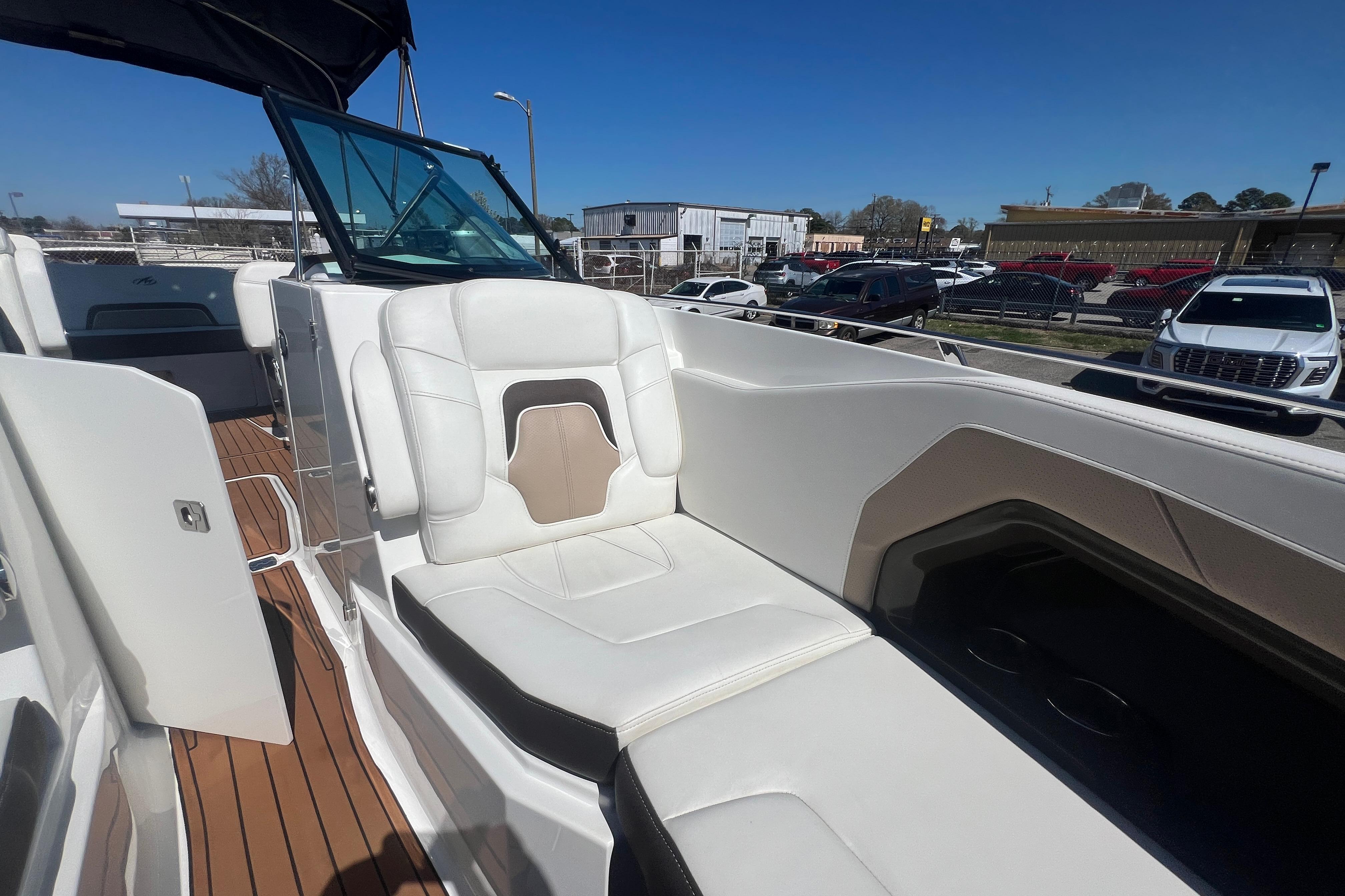 2017 Monterey 298SS Super Sport boat with white seating and wooden deck.
