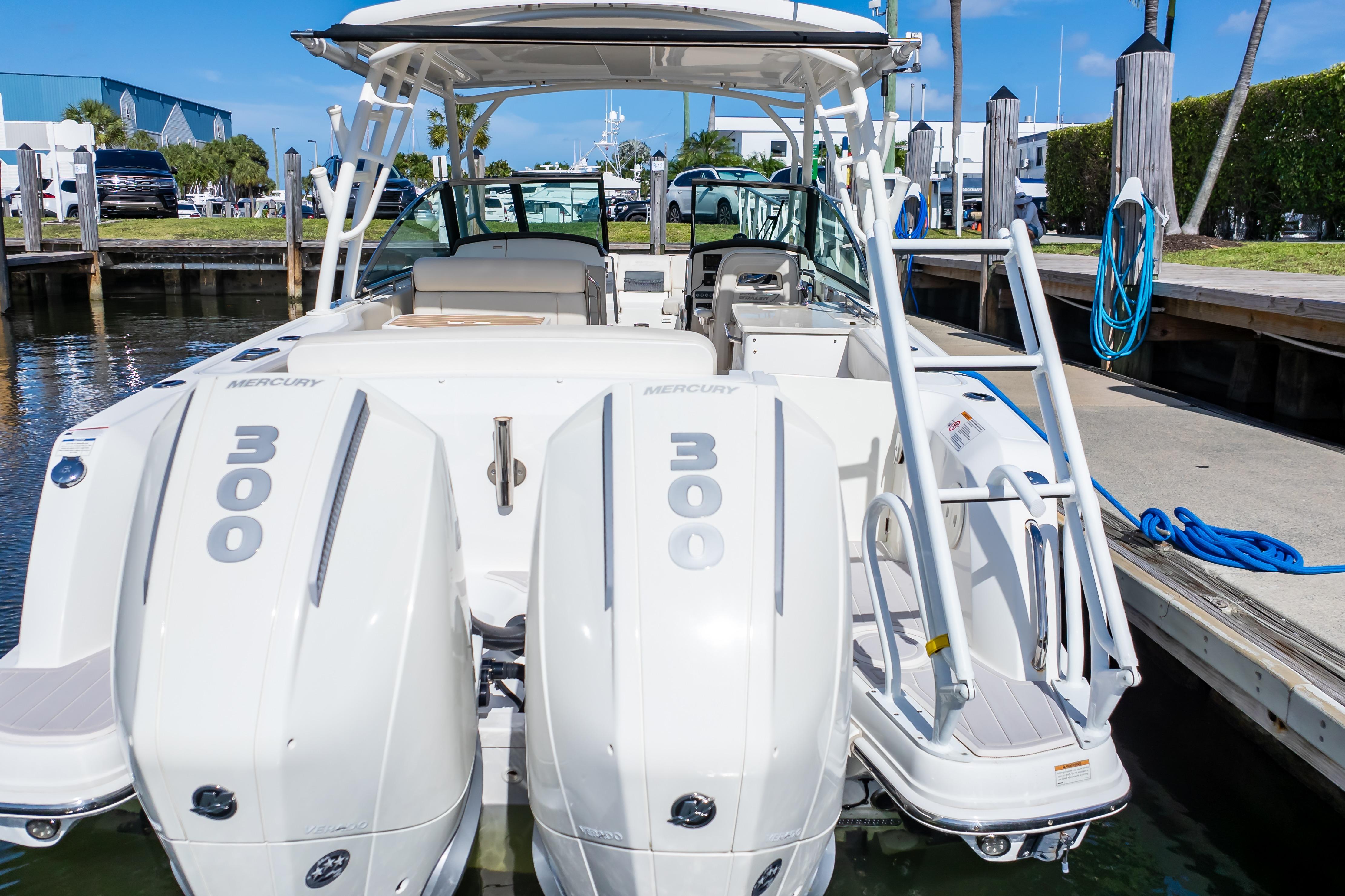2019 Boston Whaler 270 Vantage with twin Mercury 300 engines docked at marina.