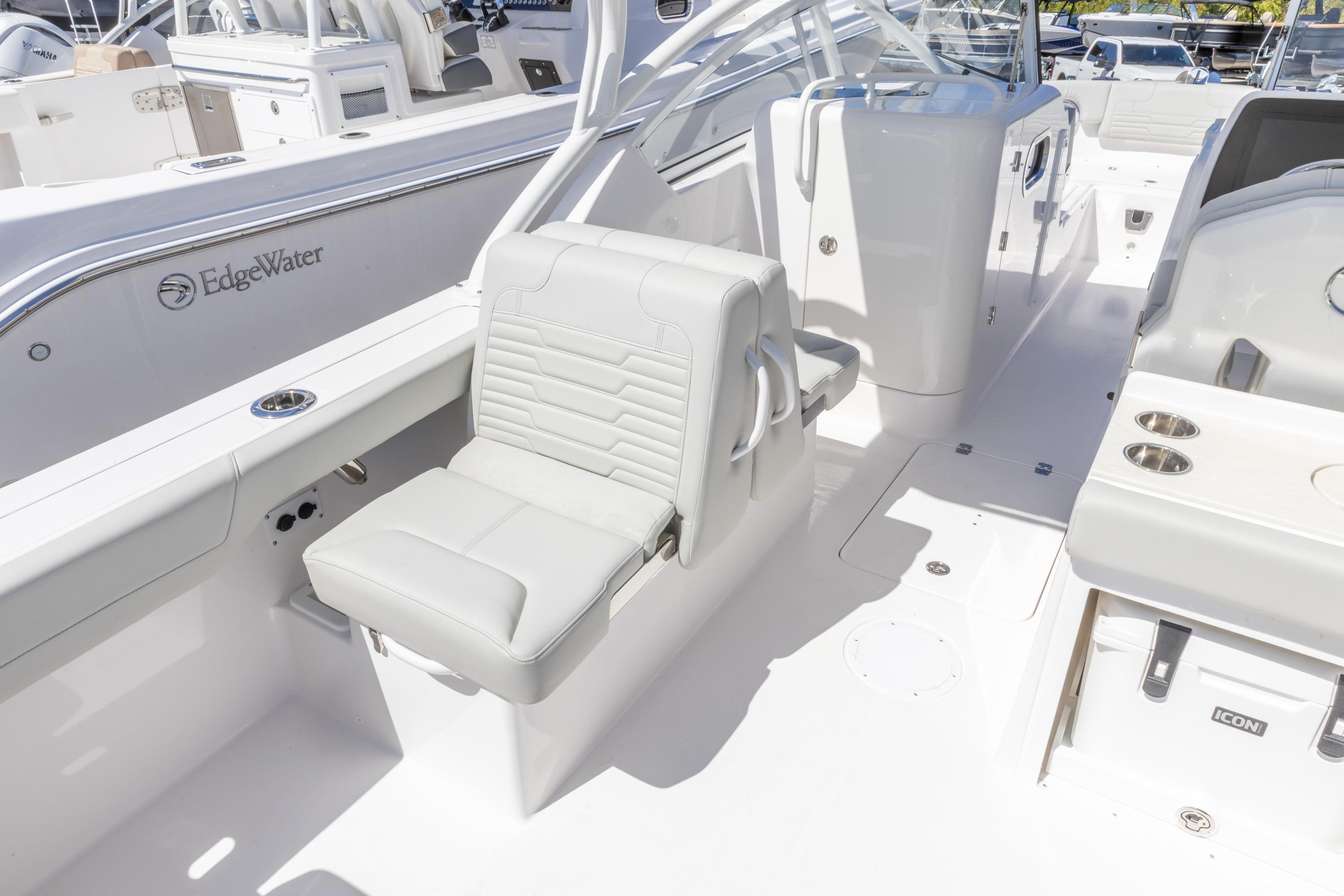 2026 Edgewater 248CX Crossover boat interior with white seating and modern design.