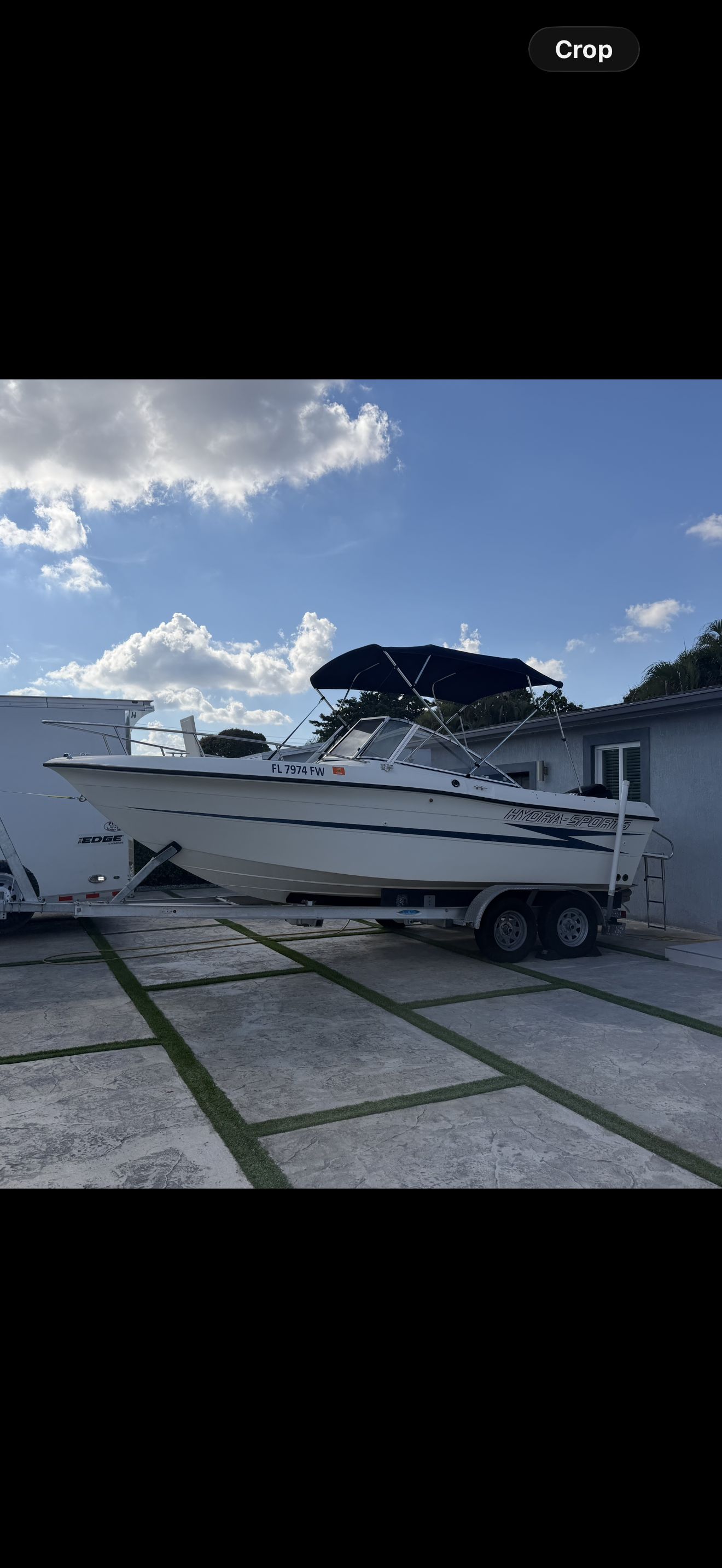 1991 Hydra-Sports DC 2000 boat on trailer outdoors.