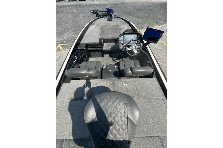 2016 Triton 20 TrX boat interior with steering wheel and seating.