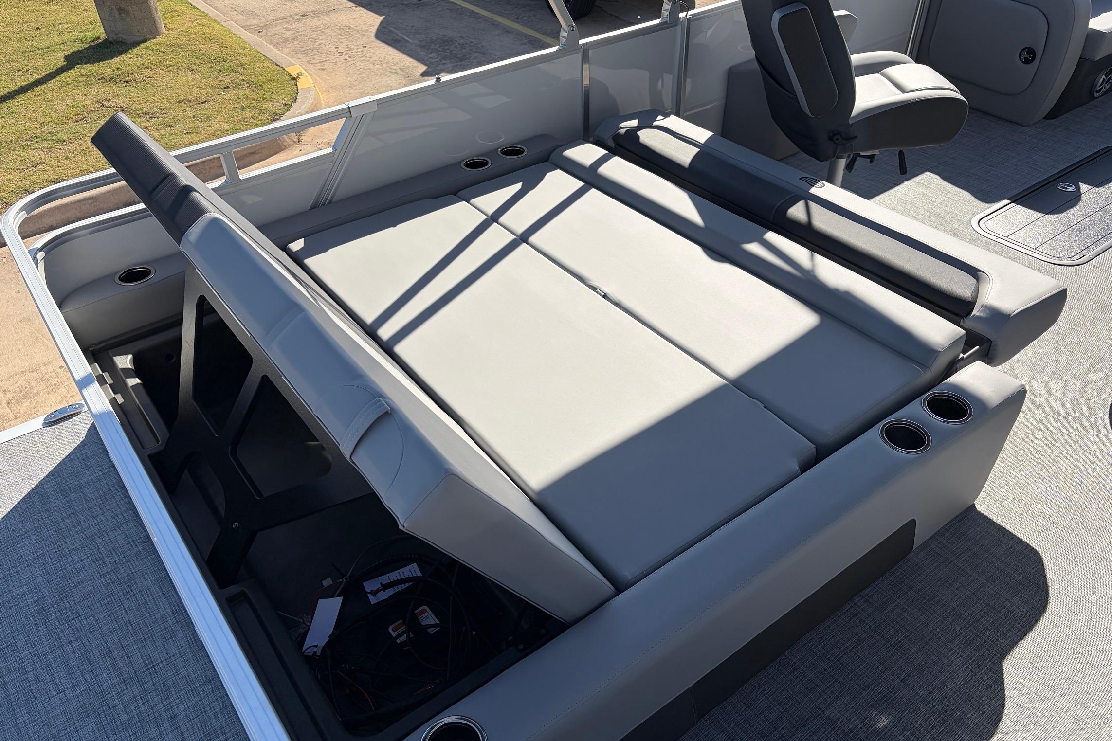 2026 Sun Tracker Party Barge 22 RF XP3 interior with gray seating and cup holders.