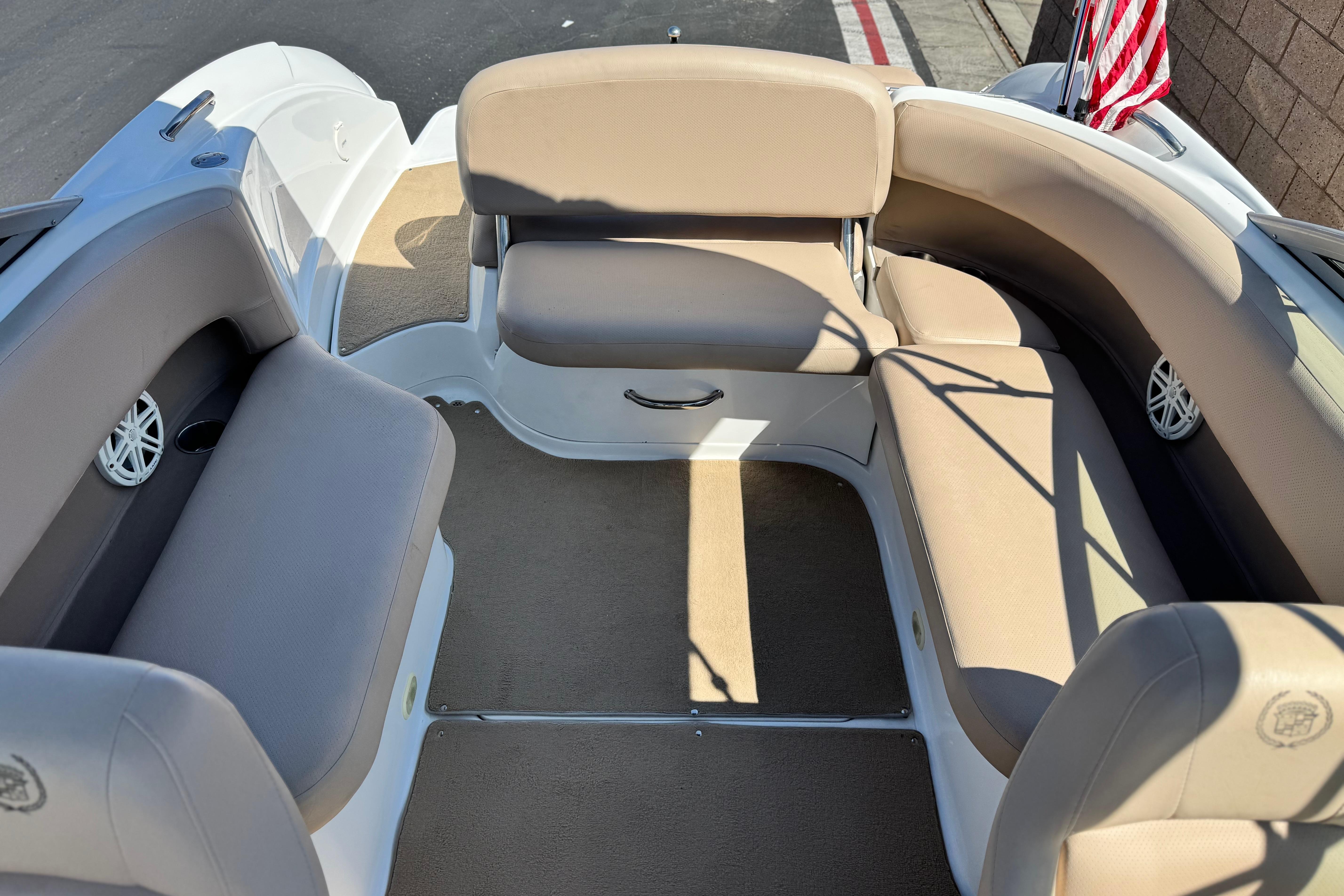 Interior of a 2008 Cobalt 262 boat with beige seating and American flag.