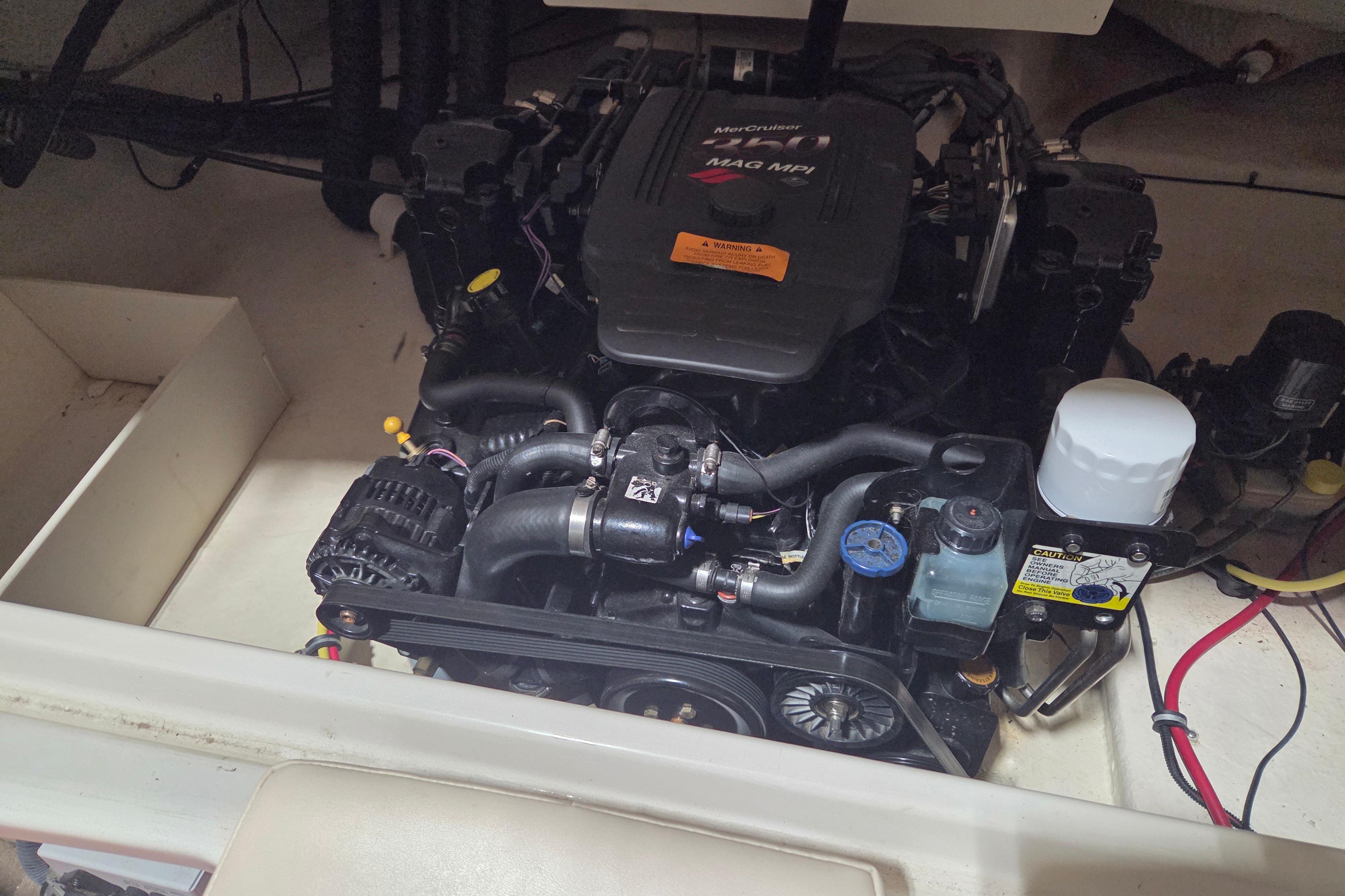 Engine compartment of a 2006 Chaparral 236 SSi boat, featuring a MerCruiser MAG MPI engine.