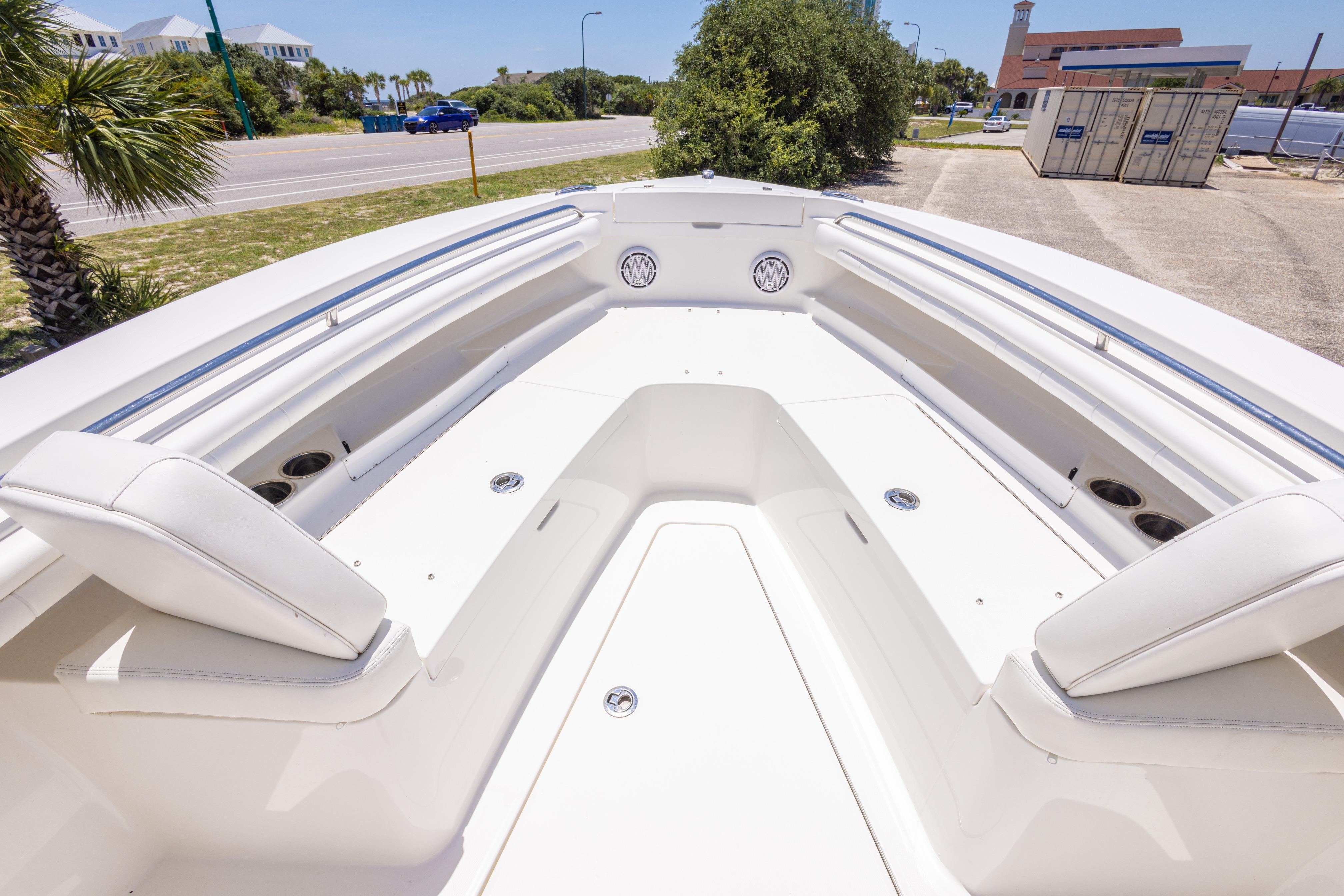 2019 Regulator 23 Center Console boat interior with white seating and cup holders.