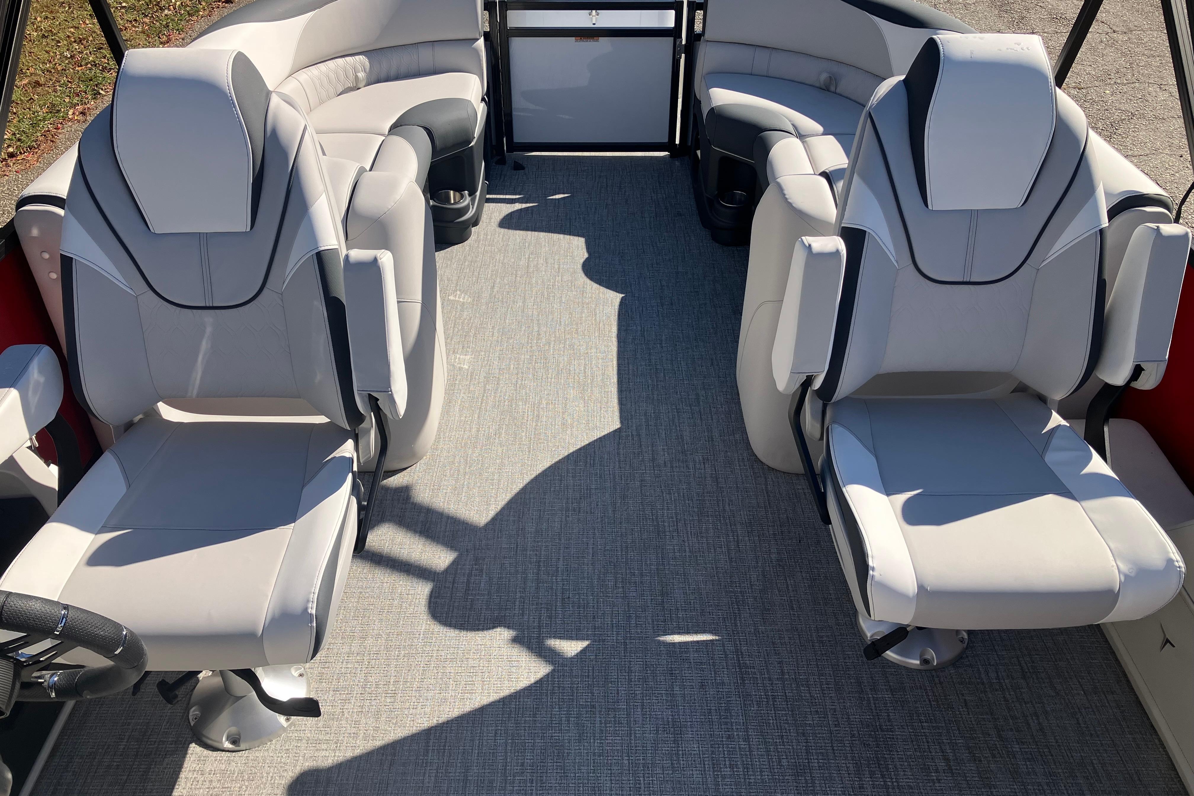 Luxurious interior of 2026 Tahoe Pontoon LTZ Quad Lounger with plush seating.