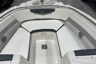 2022 Robalo R247 Dual Console boat interior with cushioned seating and speakers.