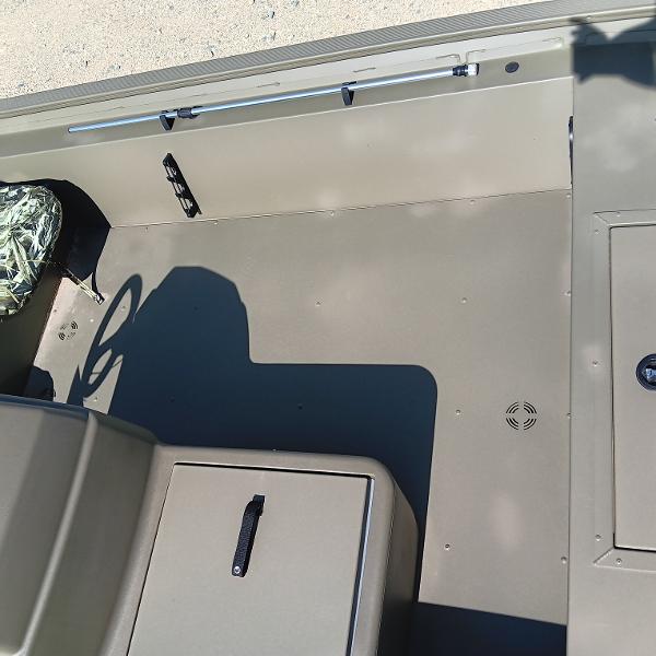 2025 Tracker Grizzly 1754 SC boat interior with steering wheel and storage compartments.