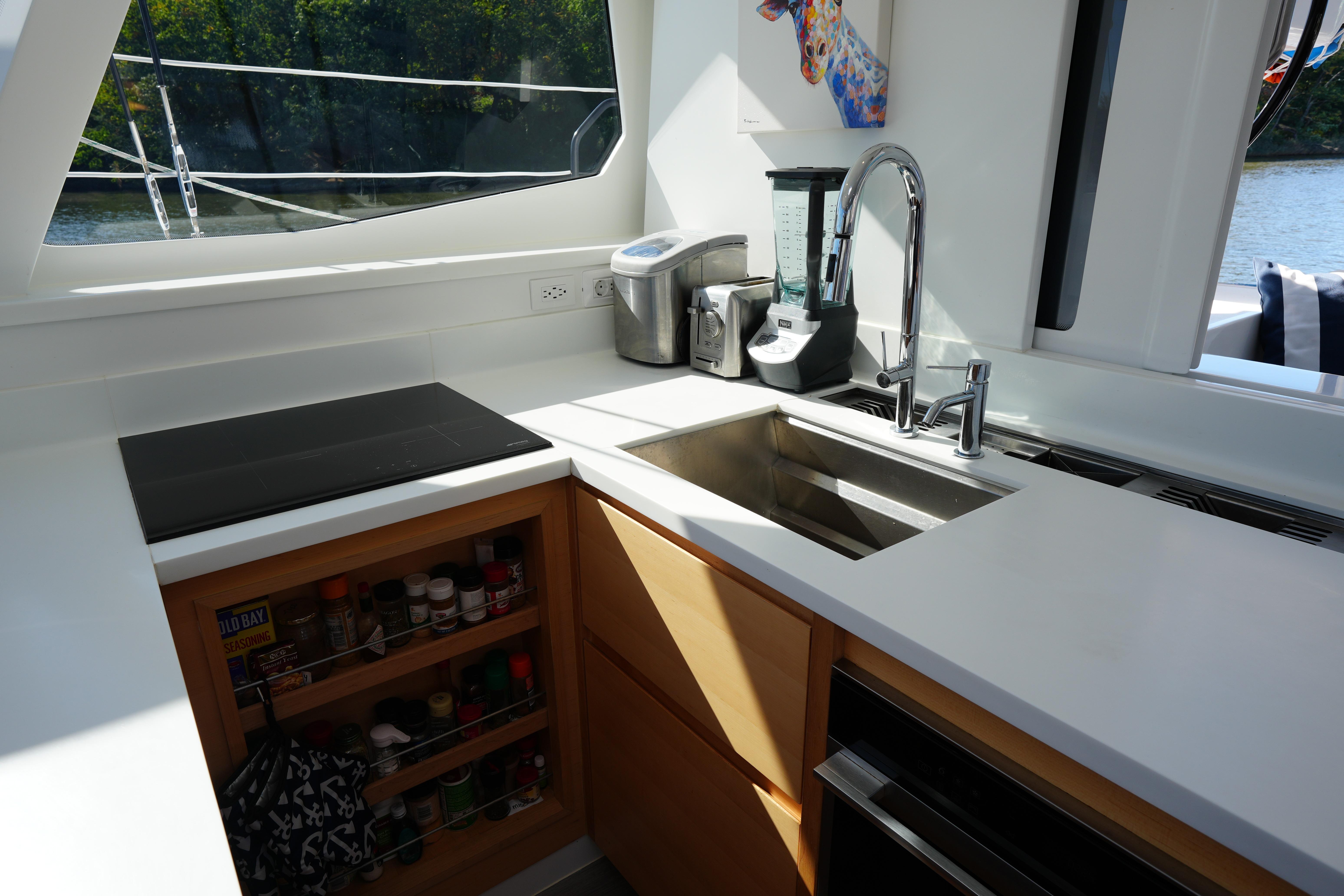 Modern kitchen in 2024 Balance 442 yacht with sleek countertops and appliances.