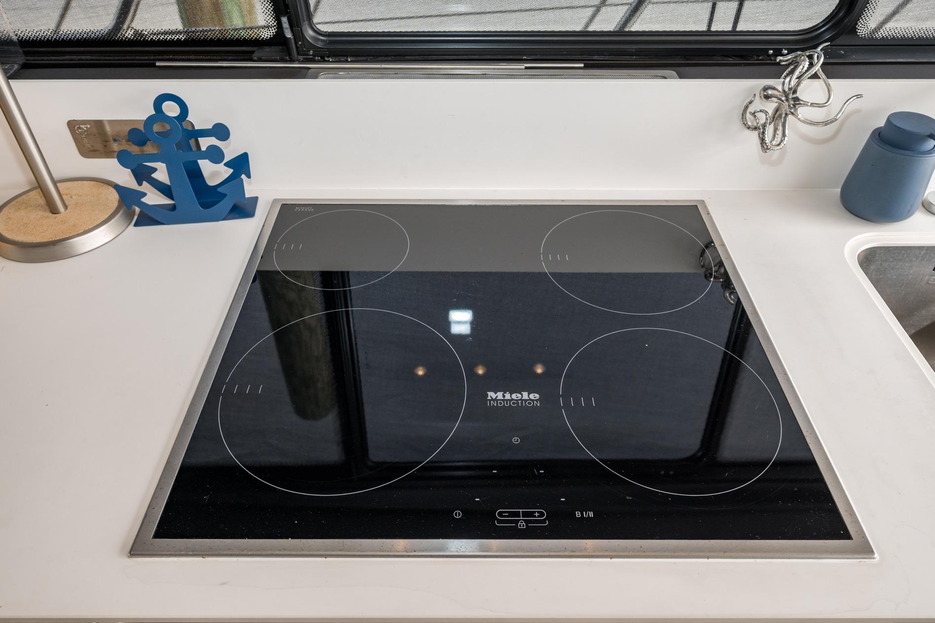 Modern kitchen with Miele induction cooktop on 2020 Azimut Fly 50 yacht.