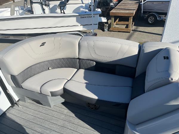 2024 Starcraft SLS3 boat with luxurious seating in a marina.