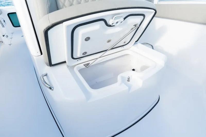 2026 Sportsman Open 282 Center Console boat with open storage compartment.
