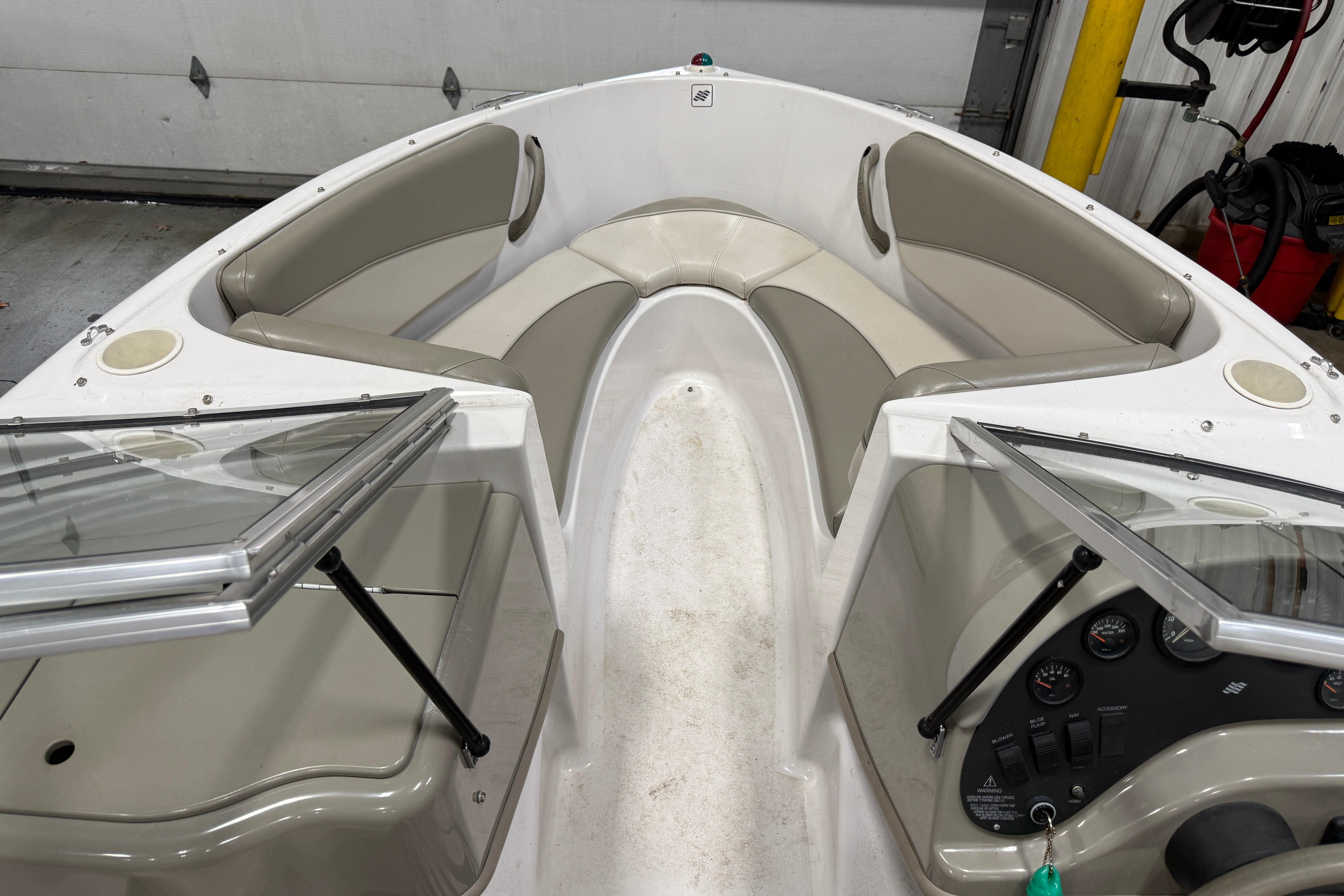 1999 Four Winns 170 Horizon LE boat interior with seating and dashboard.