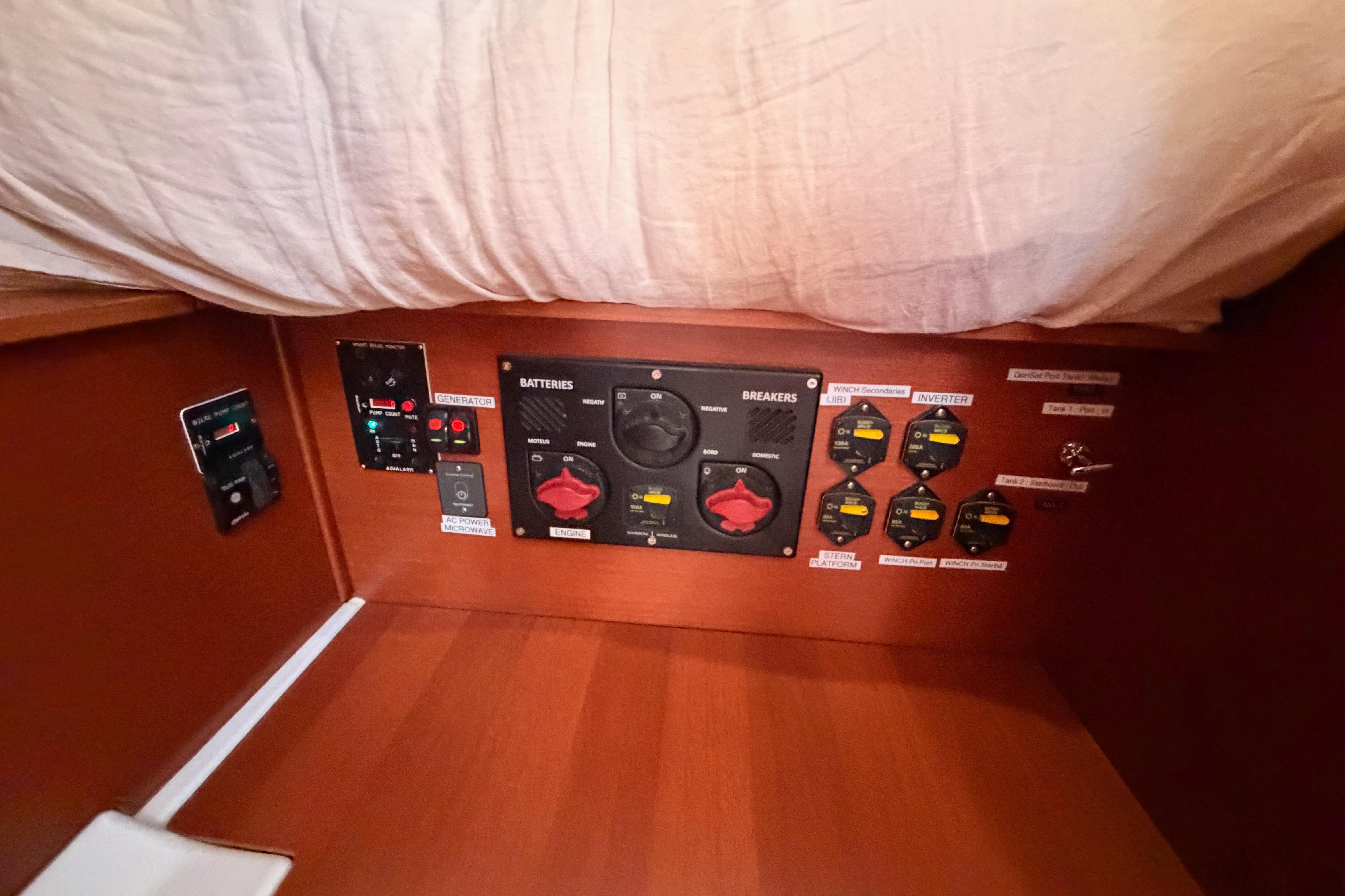 Electrical panel on a 2020 Beneteau Oceanis 46.1 yacht, featuring battery and breaker controls.
