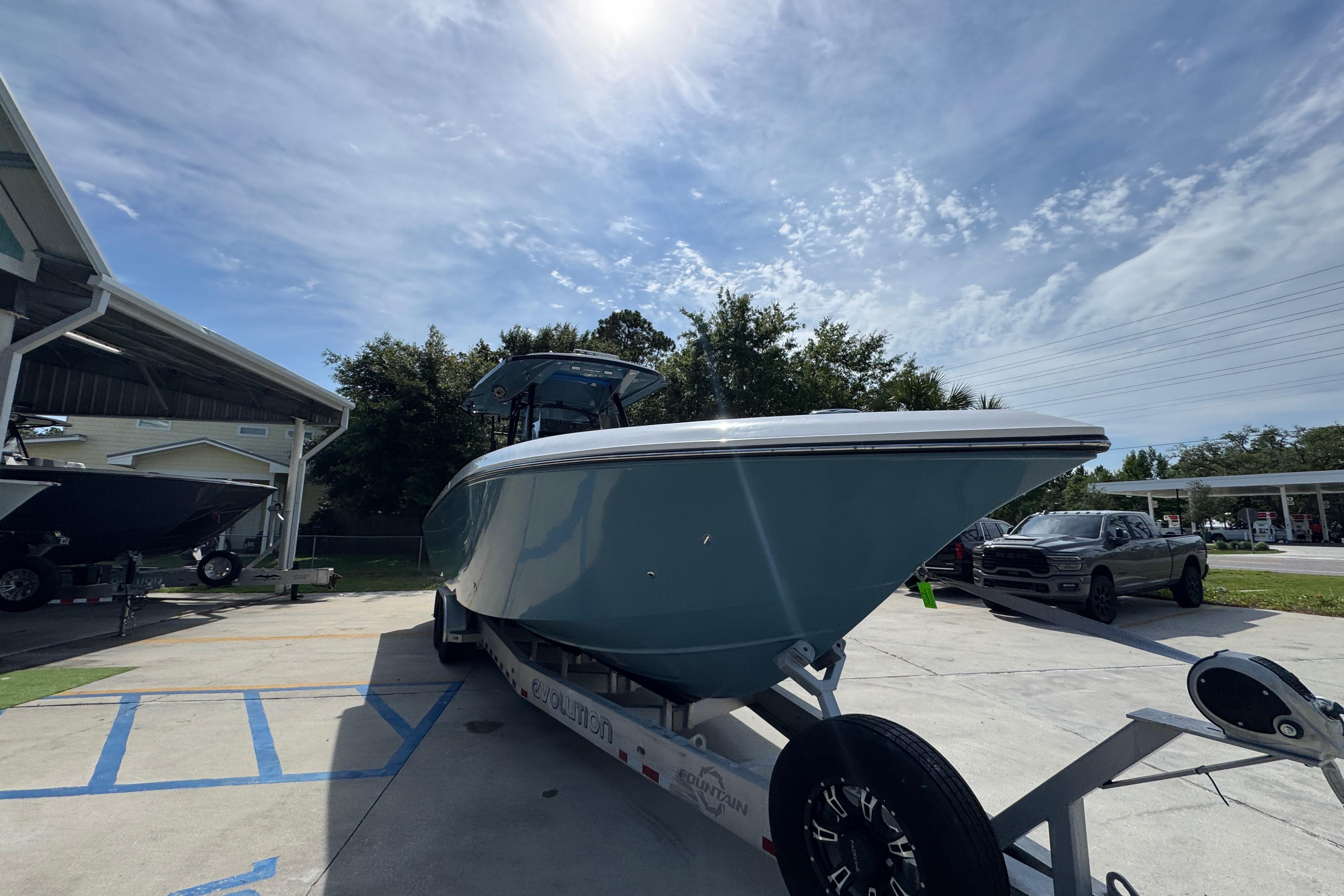 2023 Fountain 34 Tournament Edition boat on trailer under sunny sky.