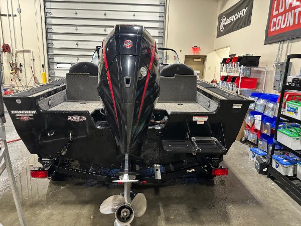 2023 Tracker Targa V-18 WT boat in a garage, rear view with motor.