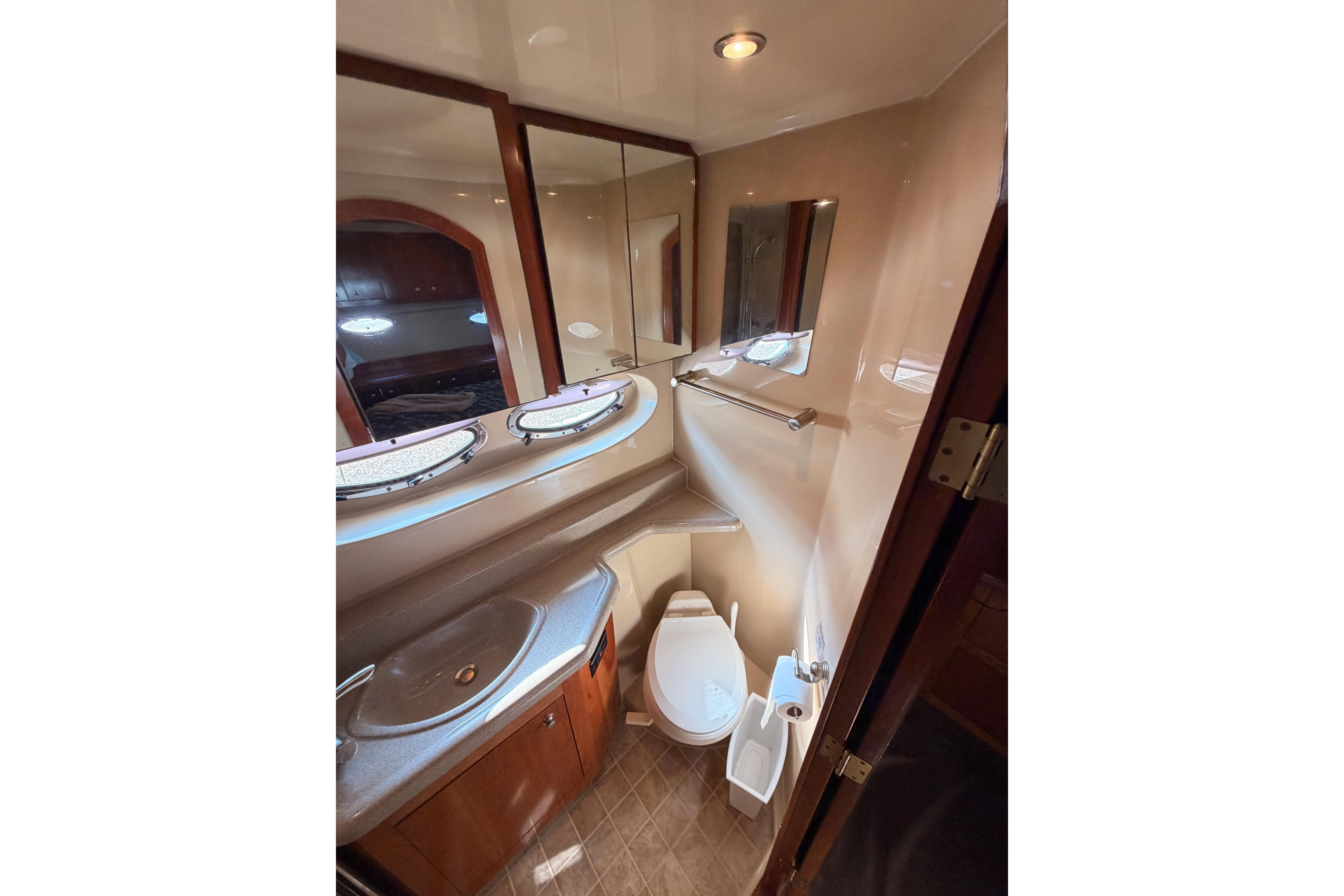 Luxurious bathroom in 2005 Cruisers Yachts 405 Express Motoryacht with modern fixtures.