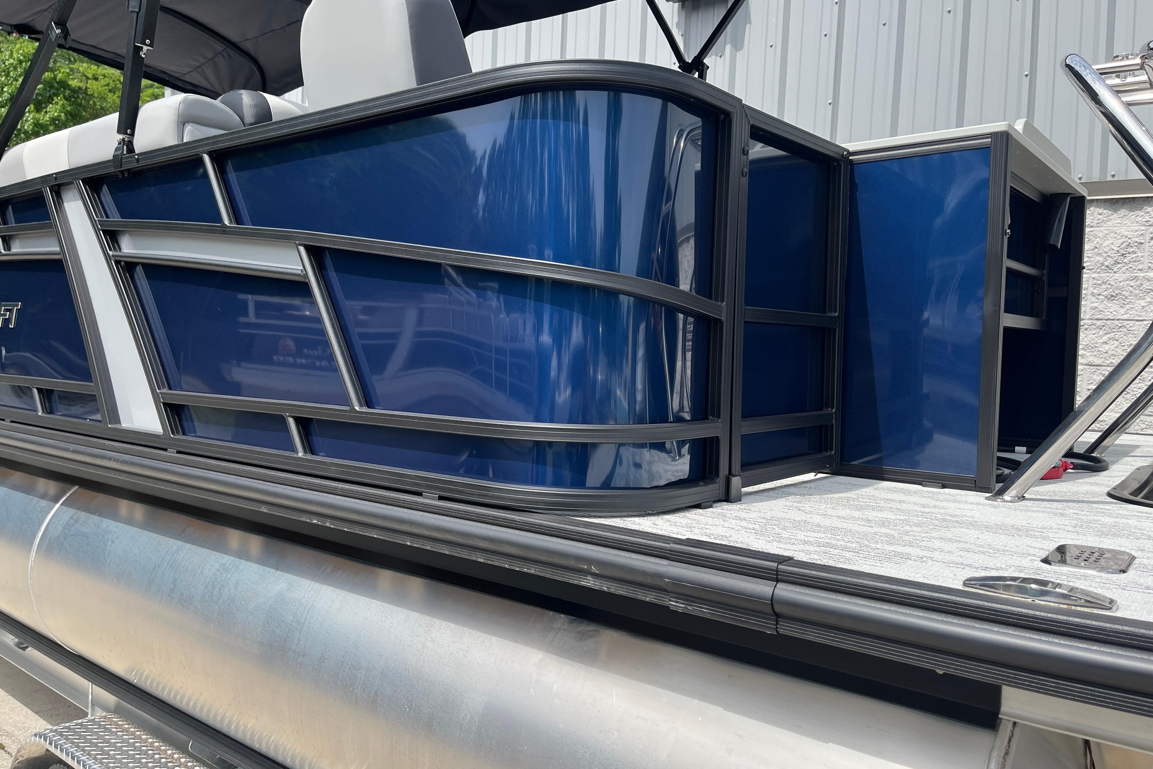 2026 Starcraft EXS 3 FD pontoon boat with sleek blue exterior and modern design.