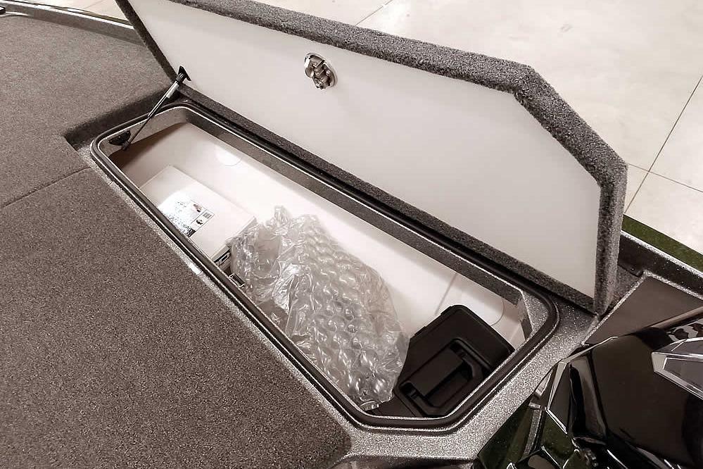 Open storage compartment in 2026 Ranger Z519R Cup-Equipped boat, showing interior details.