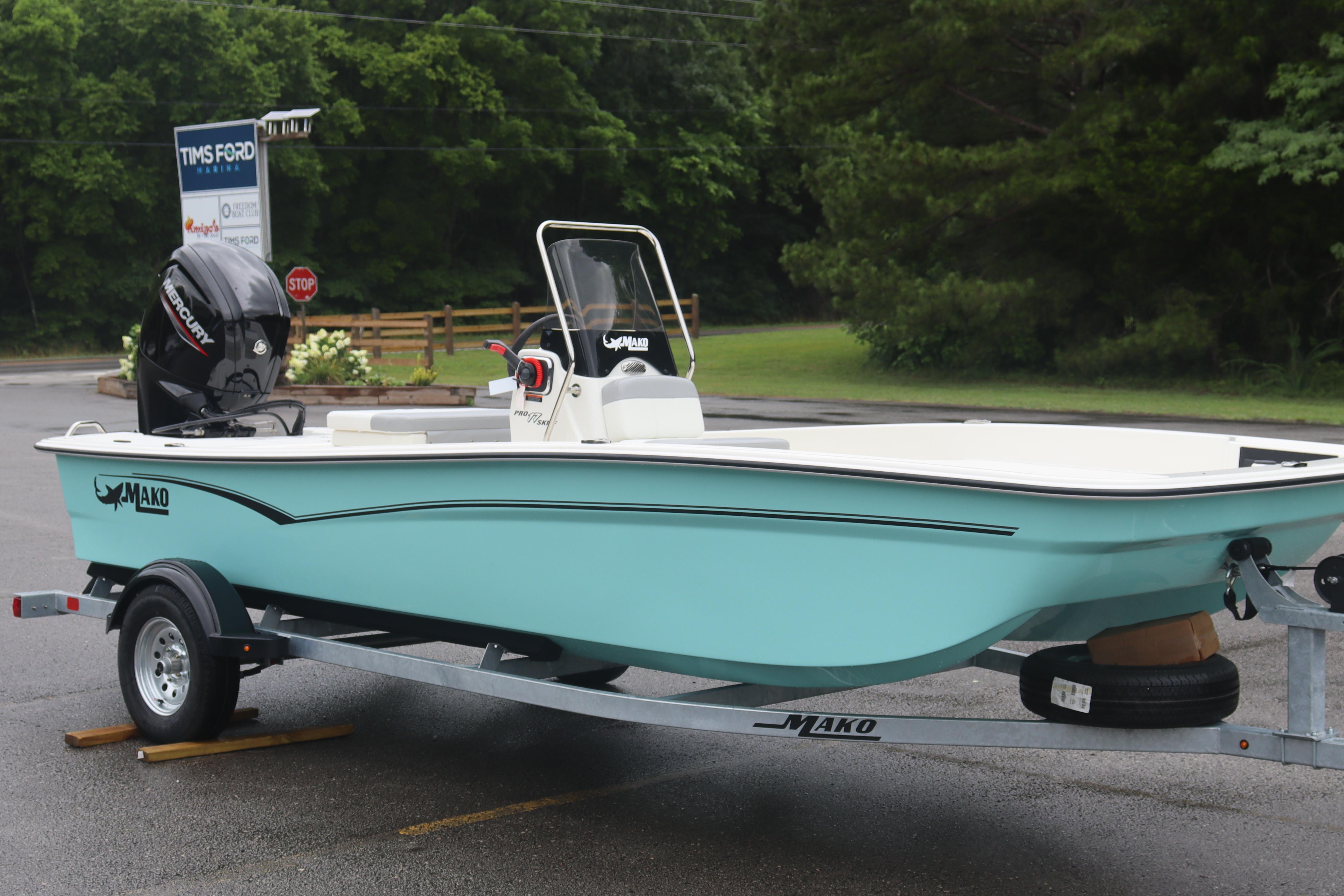 2026 Mako Pro Skiff 17 CC boat on trailer, parked outdoors.