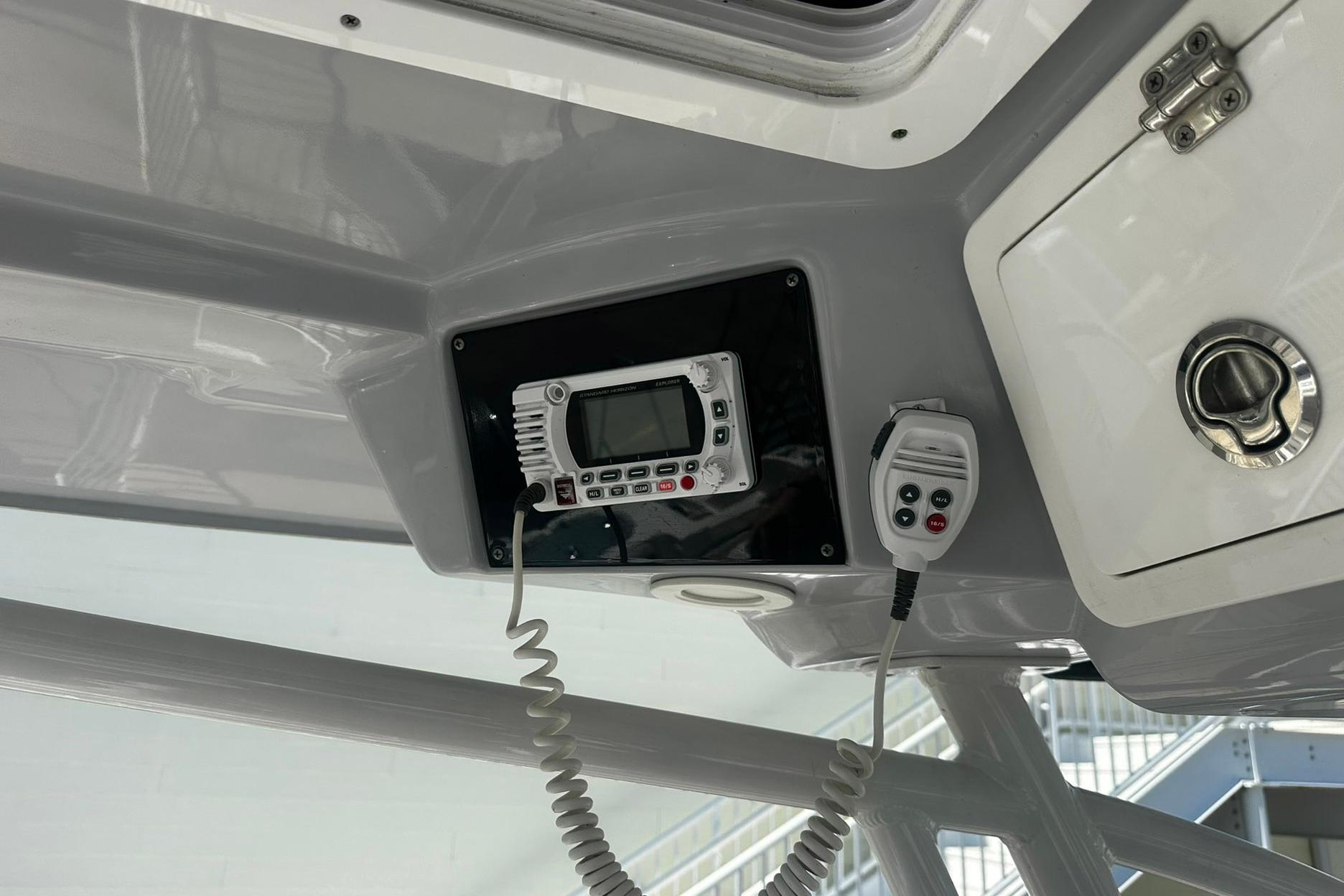 Ceiling-mounted radio and control panel on a 2002 Sea Fox 228 Commander boat.