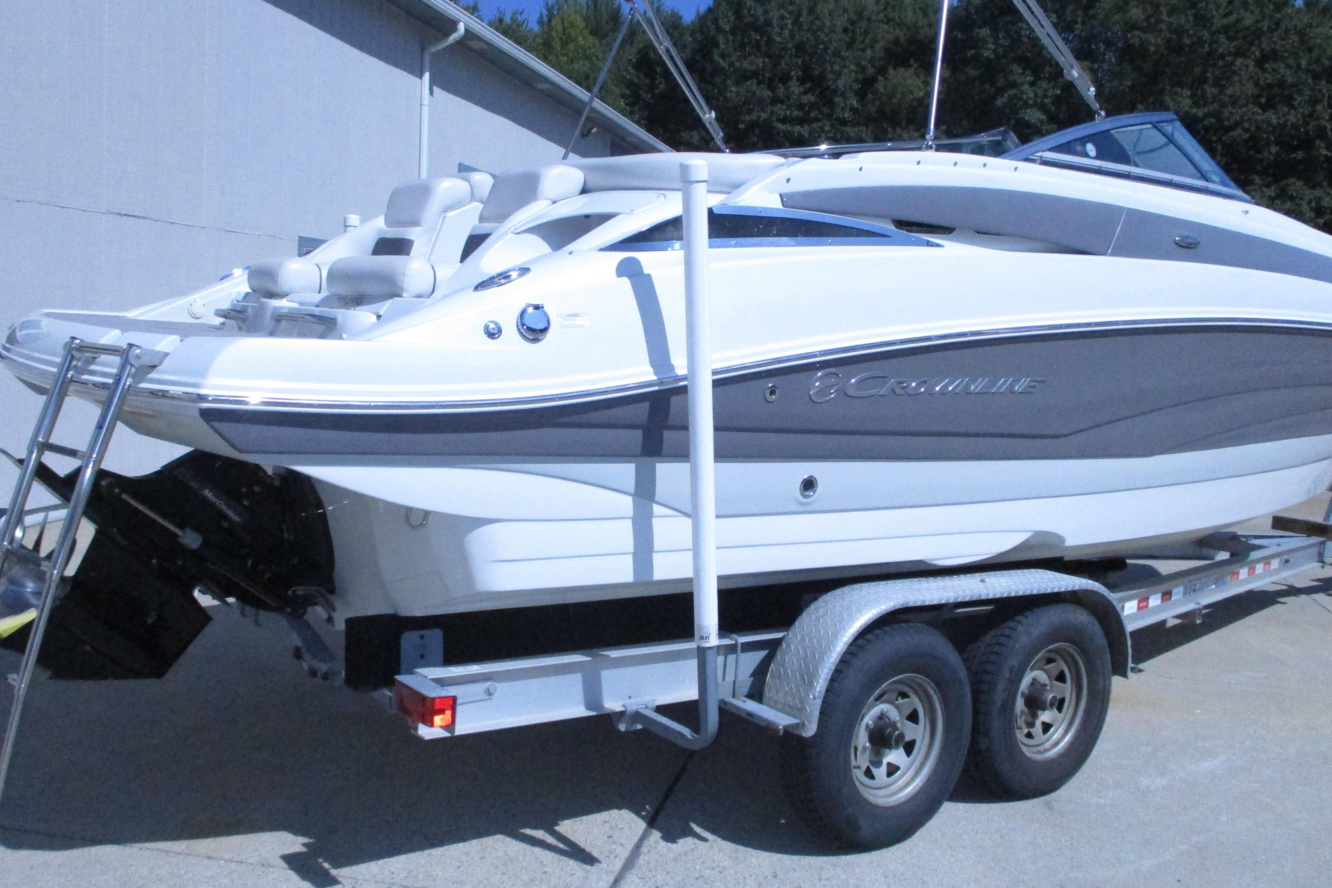 2017 Crownline 255 SS boat on trailer, white and gray exterior, parked outdoors.