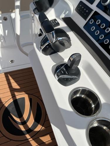 Edgewater 340CC 2023 boat control panel with joystick and throttle.