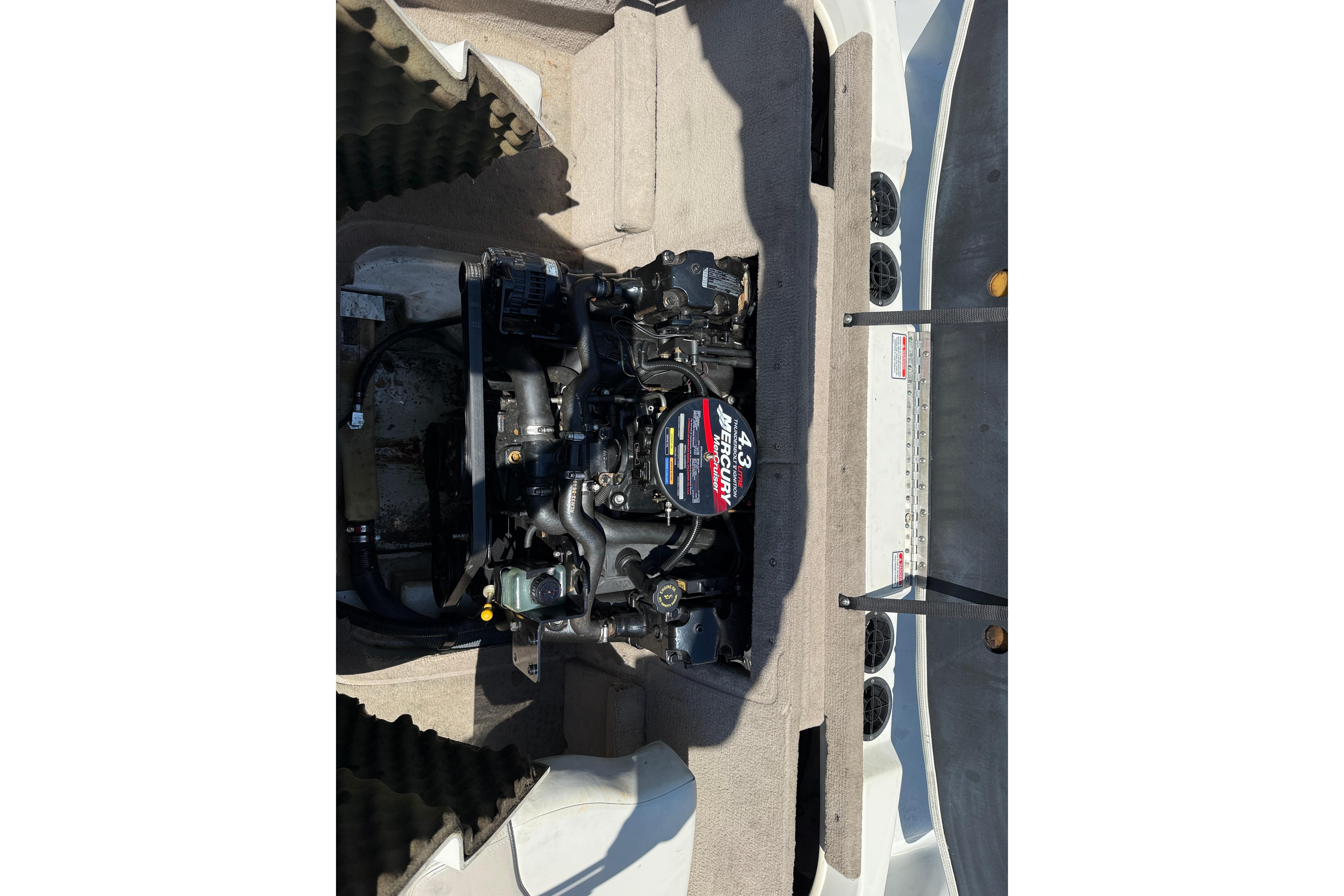 Engine compartment of a 2003 Sea Ray 182 Bow Rider boat.