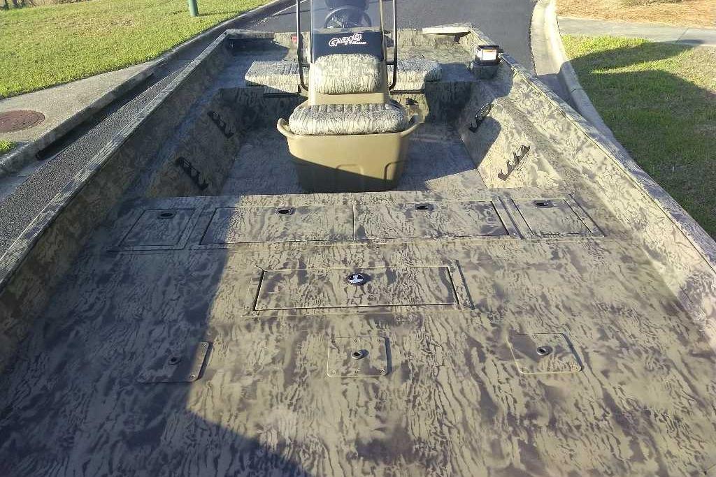 2026 Tracker Grizzly 2072 CC boat with camouflage interior design.