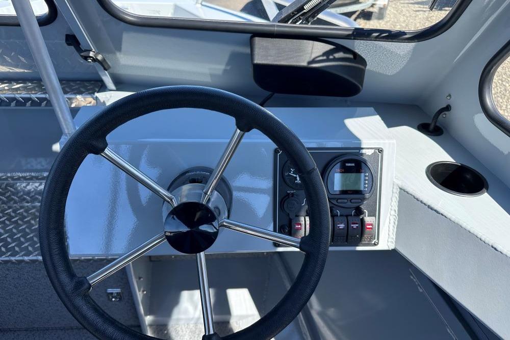 Steering wheel and dashboard of 2026 Hewescraft 180 ProV ET boat.