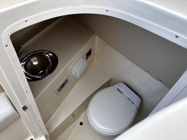 2014 Chris-Craft 28 LAUNCH boat interior bathroom with toilet and sink.