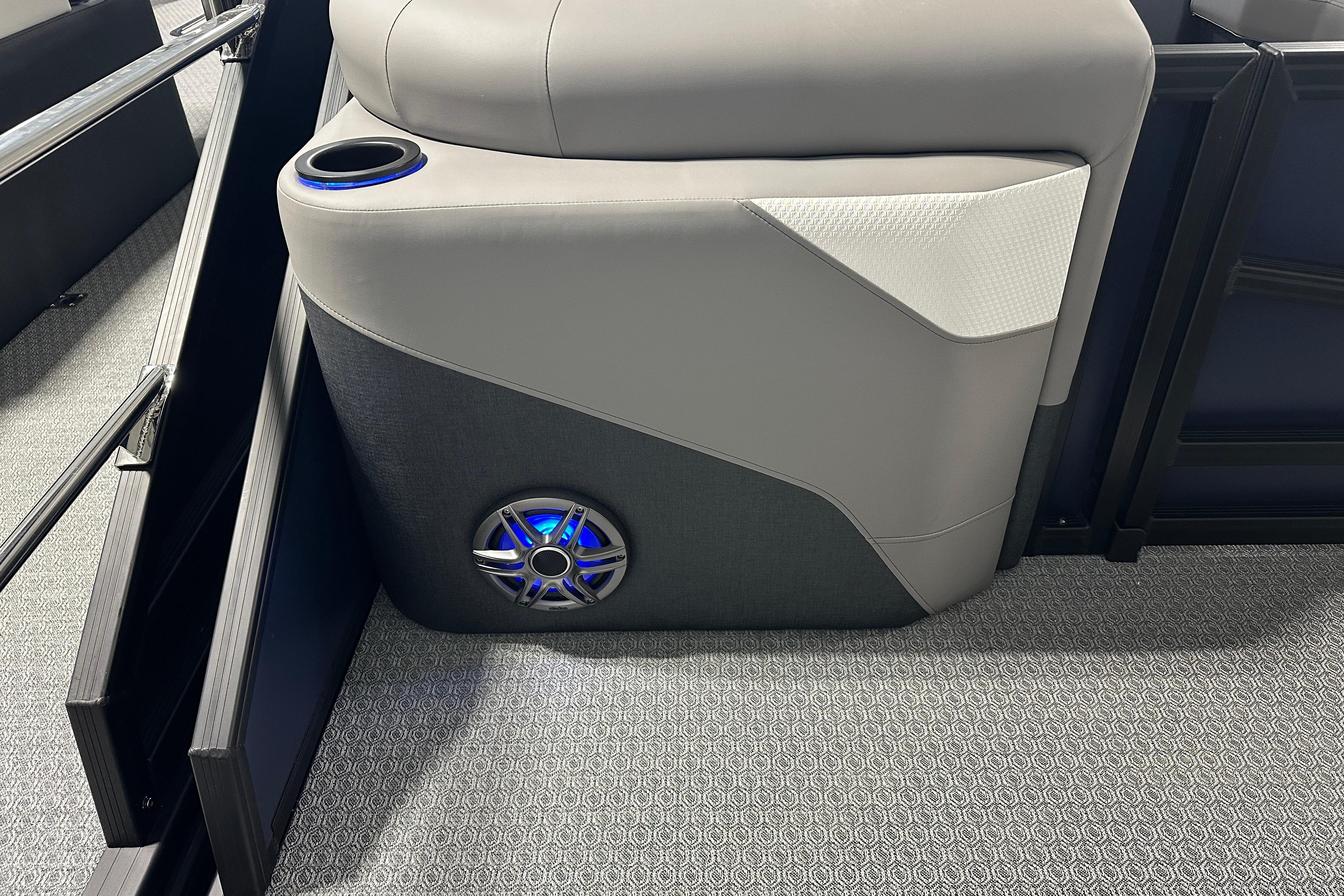 Luxury seating with cup holder and speaker in 2026 Evotti 523QL boat.