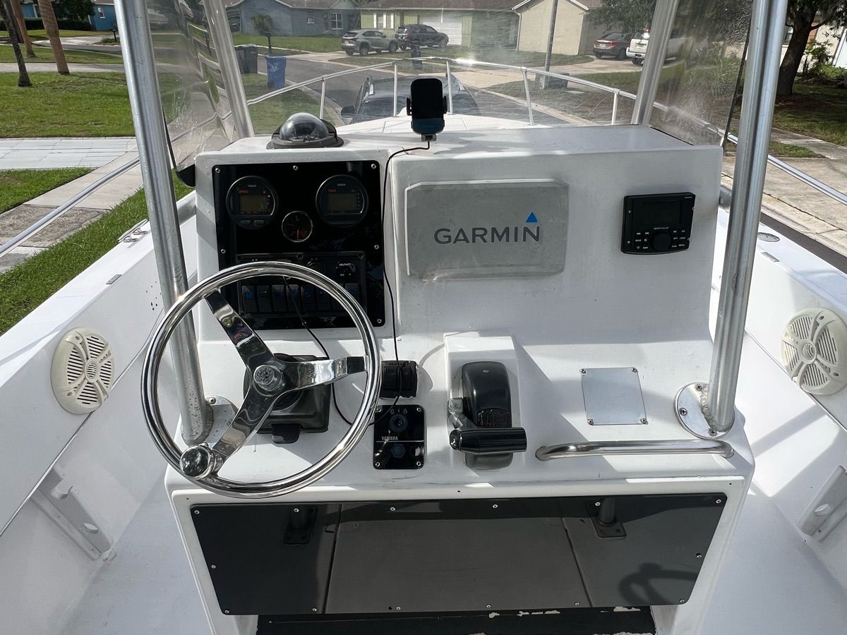The image shows the helm of a 1994 Sea Ray Laguna boat with Garmin equipment.