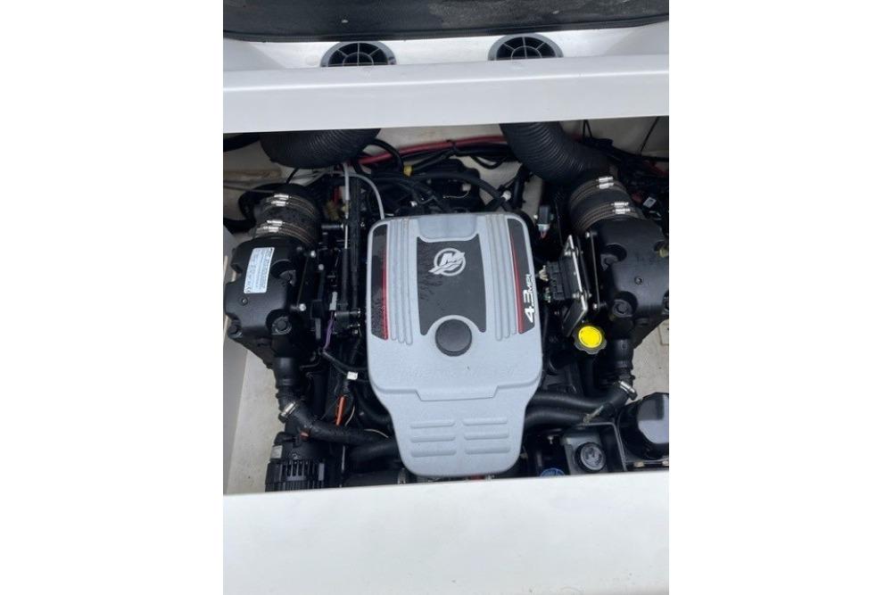Engine compartment of a 2015 Sea Ray 210 SLX boat, featuring a 4.3L engine.