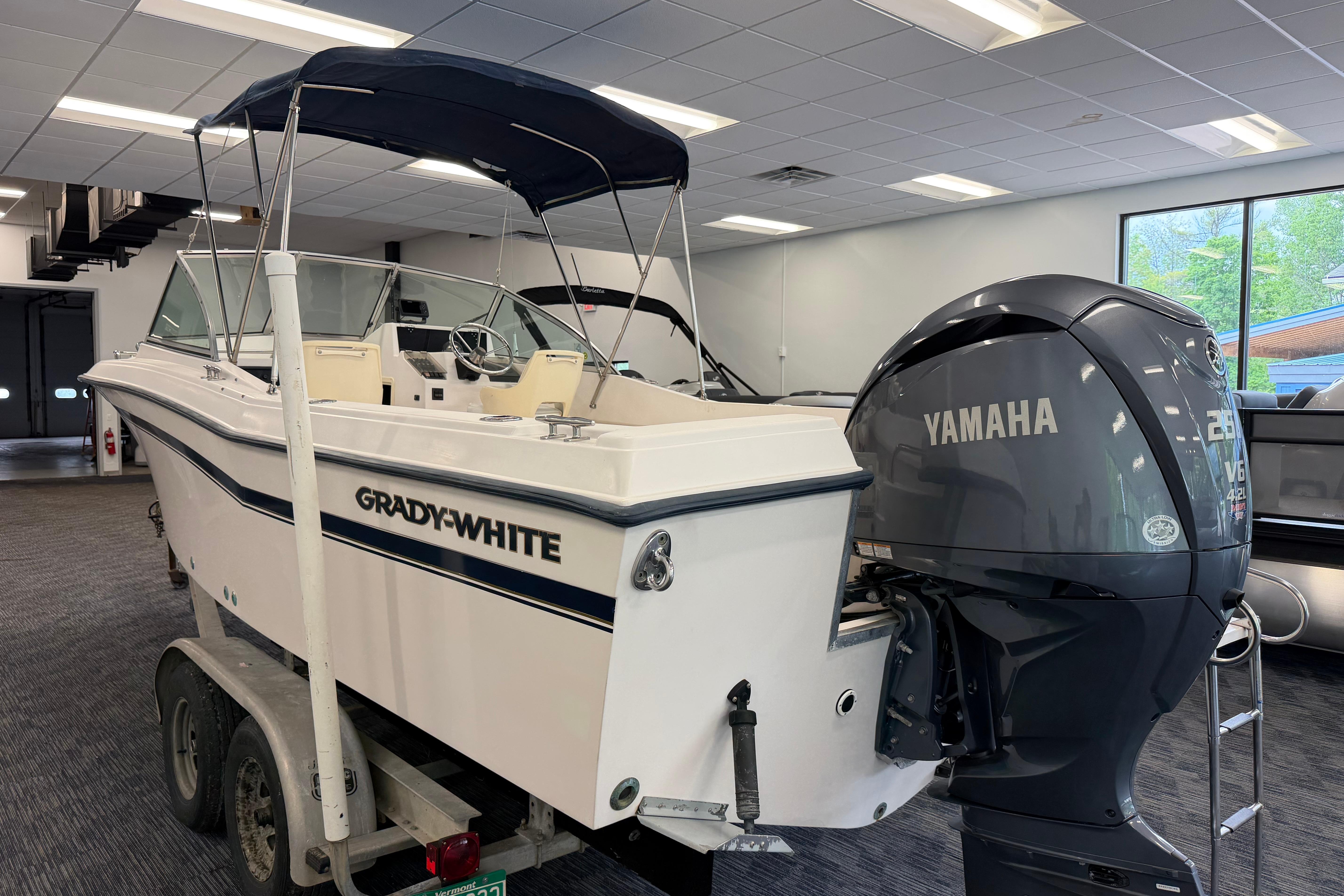 2001 Grady-White Tournament 223 boat with Yamaha engine in showroom.