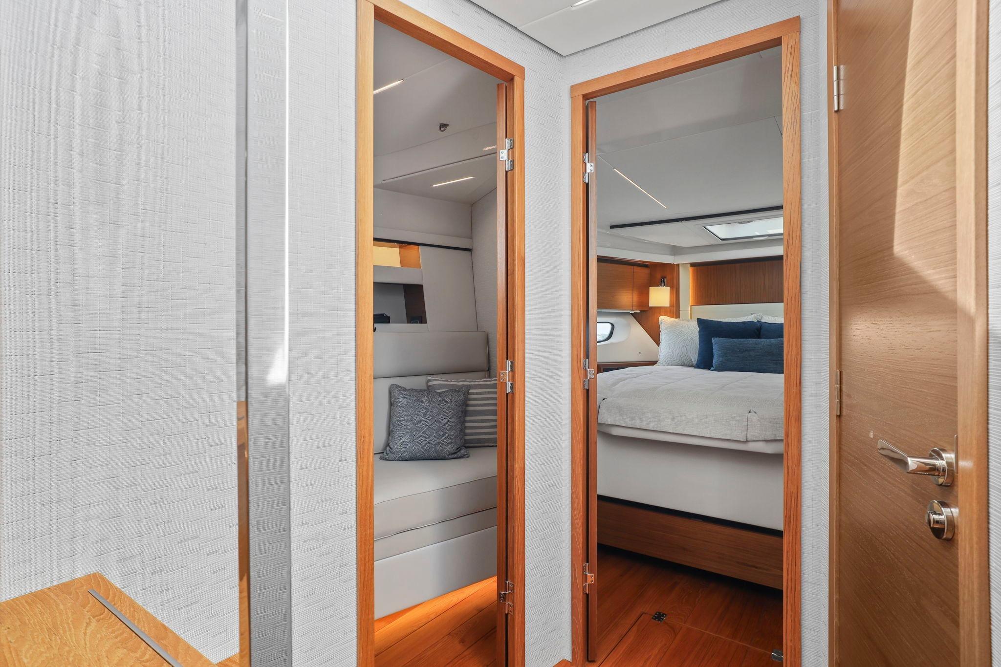 2023 Tiara Yachts C49 Coupe interior with modern bedroom and seating area.