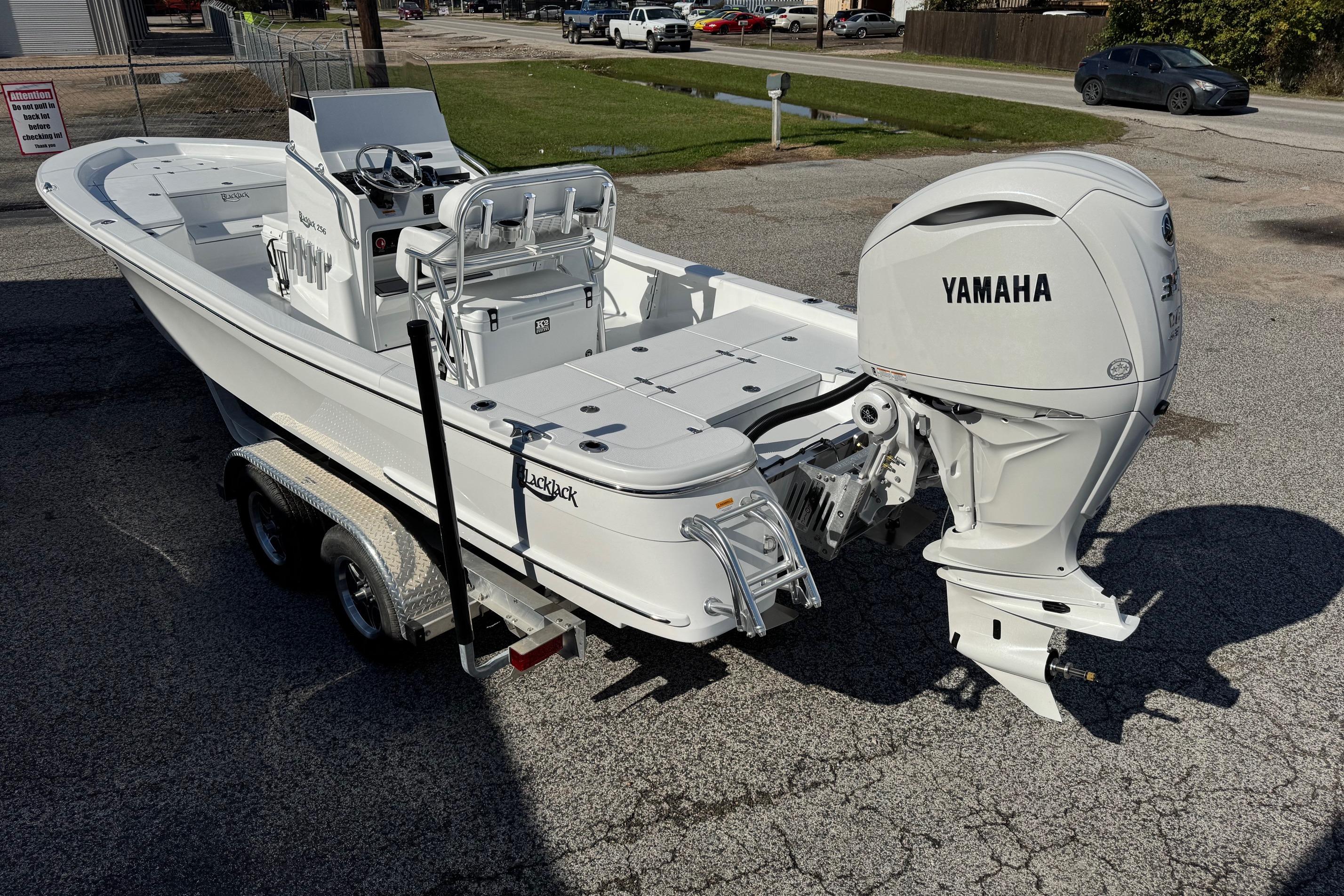 2026 BlackJack 256 Bay boat with Yamaha outboard motor on a trailer.