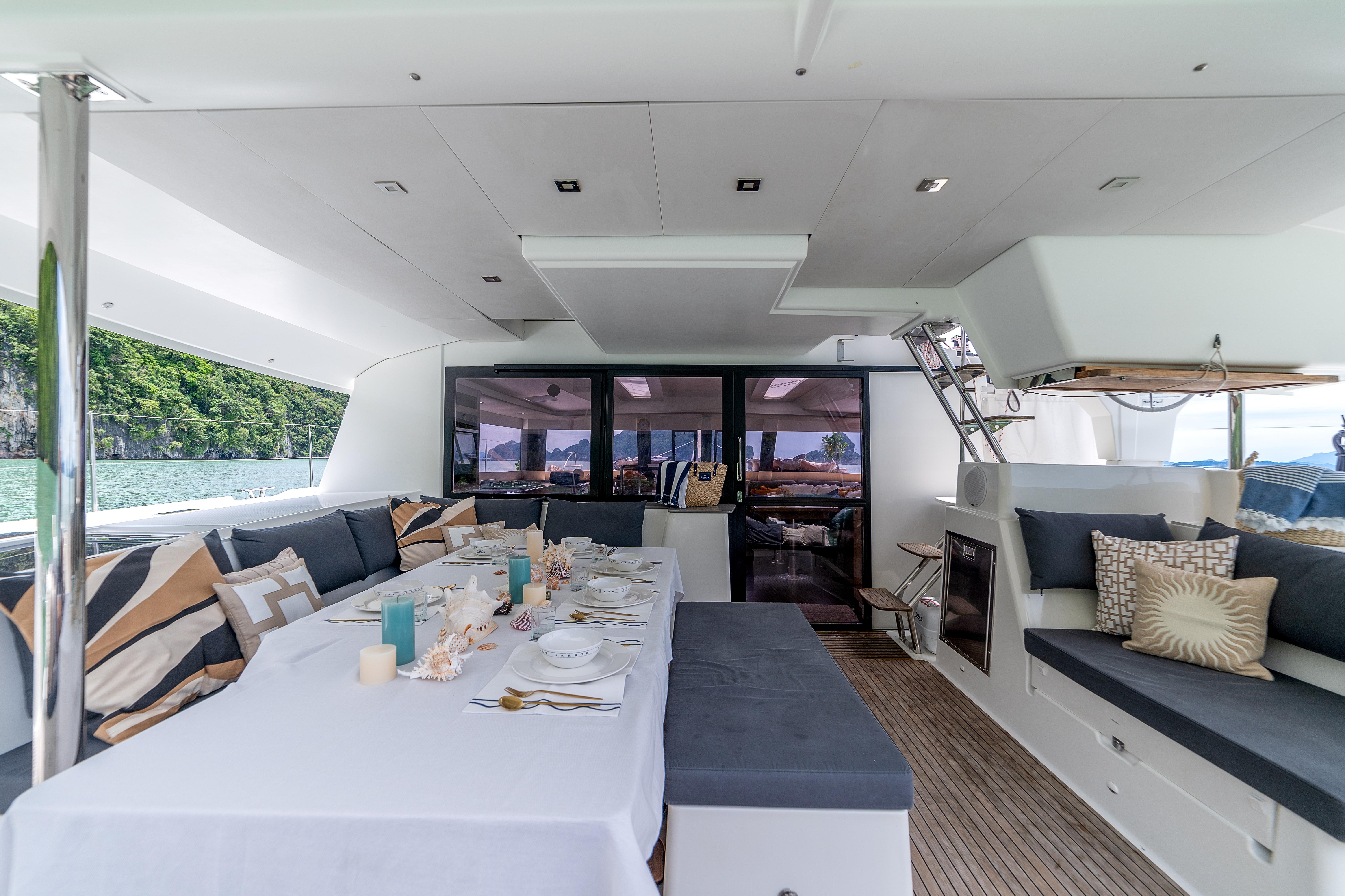 Luxurious 2017 Fountaine Pajot SABA 50 yacht interior with elegant dining setup.